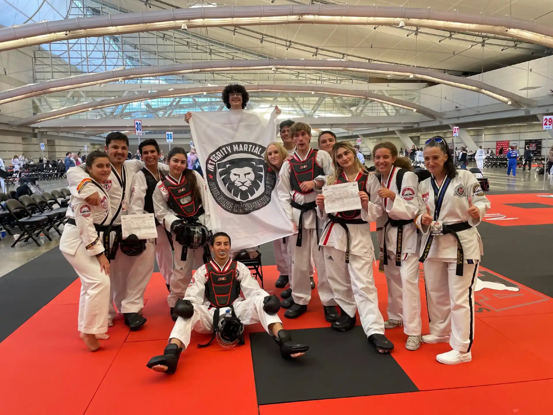 a group of people in karate uniforms