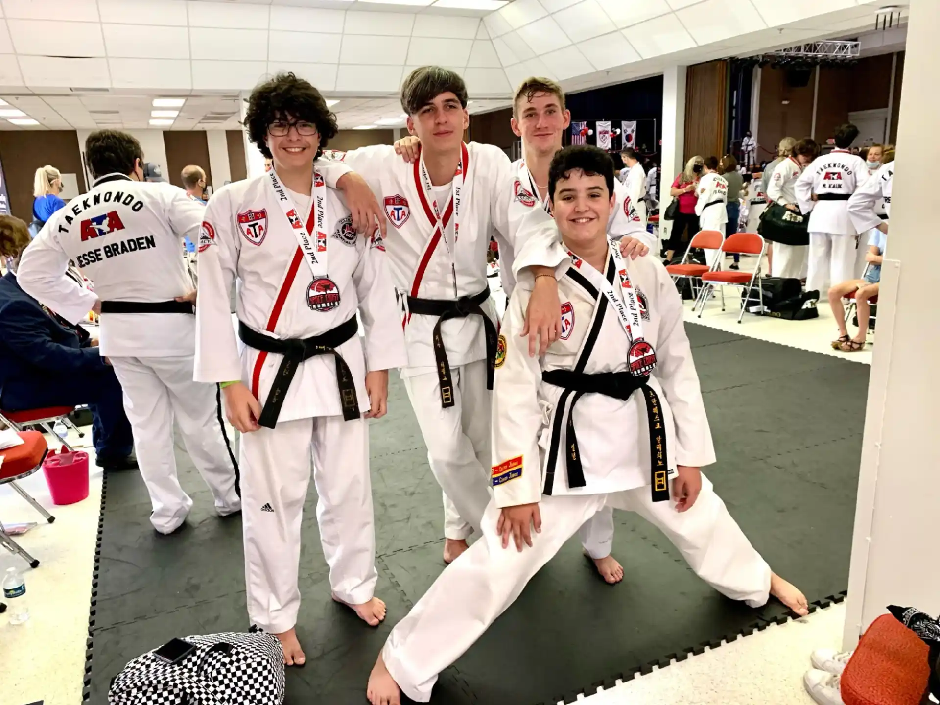 a group of people in karate uniforms