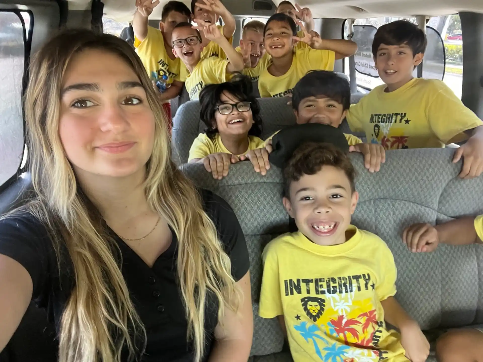a group of people sitting together smiling