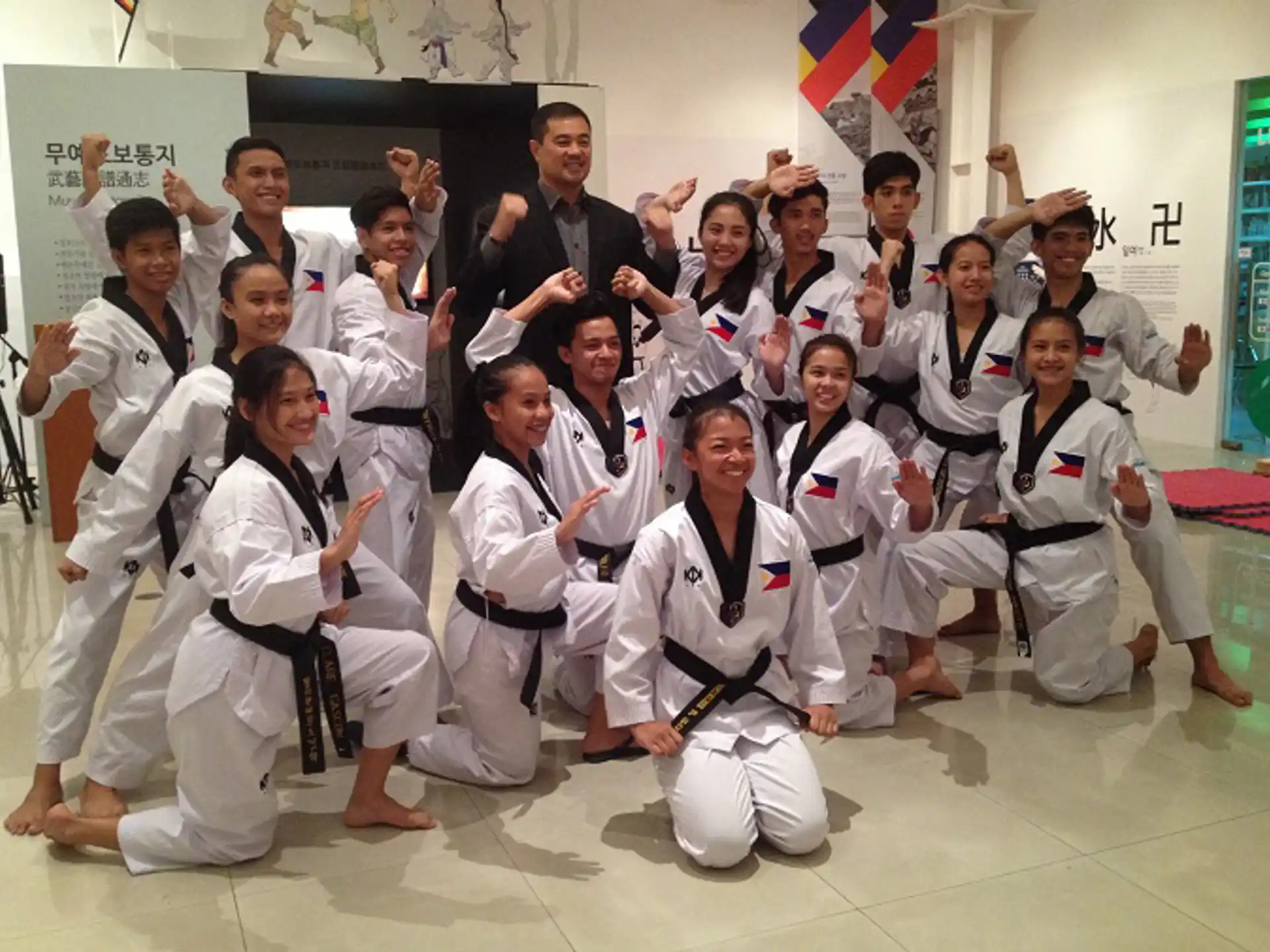 a group of people in karate uniforms