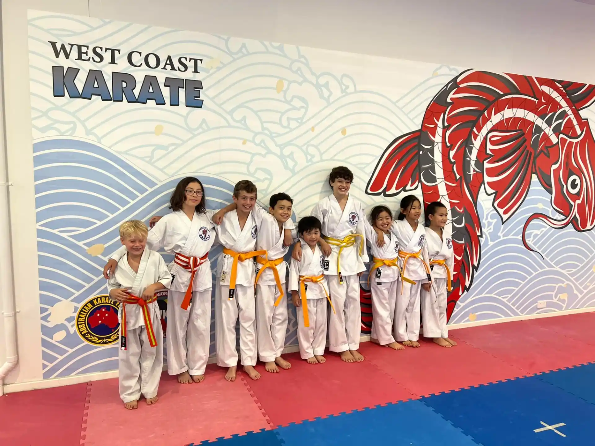 a group of people in karate uniforms