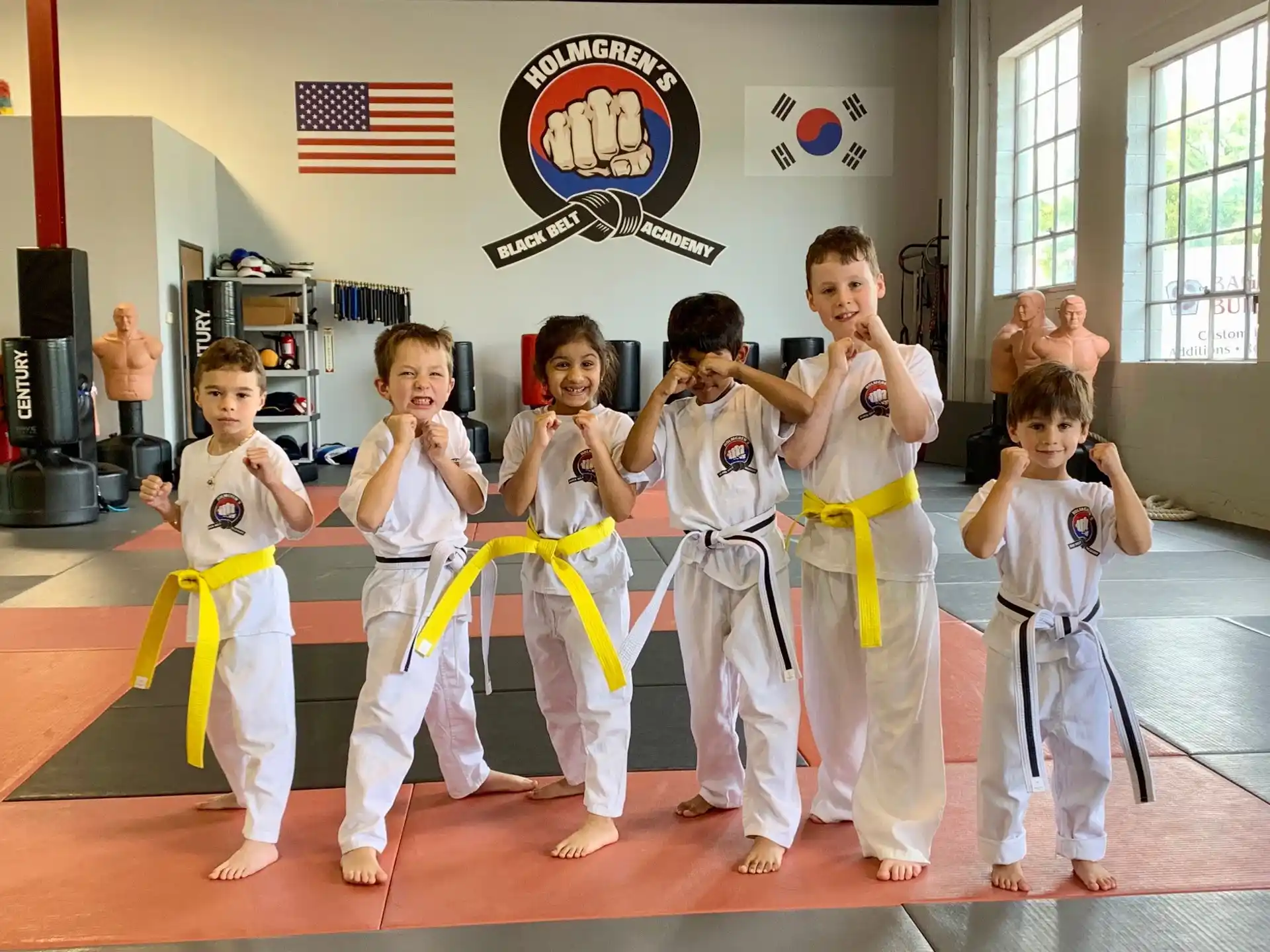 a group of people in karate uniforms