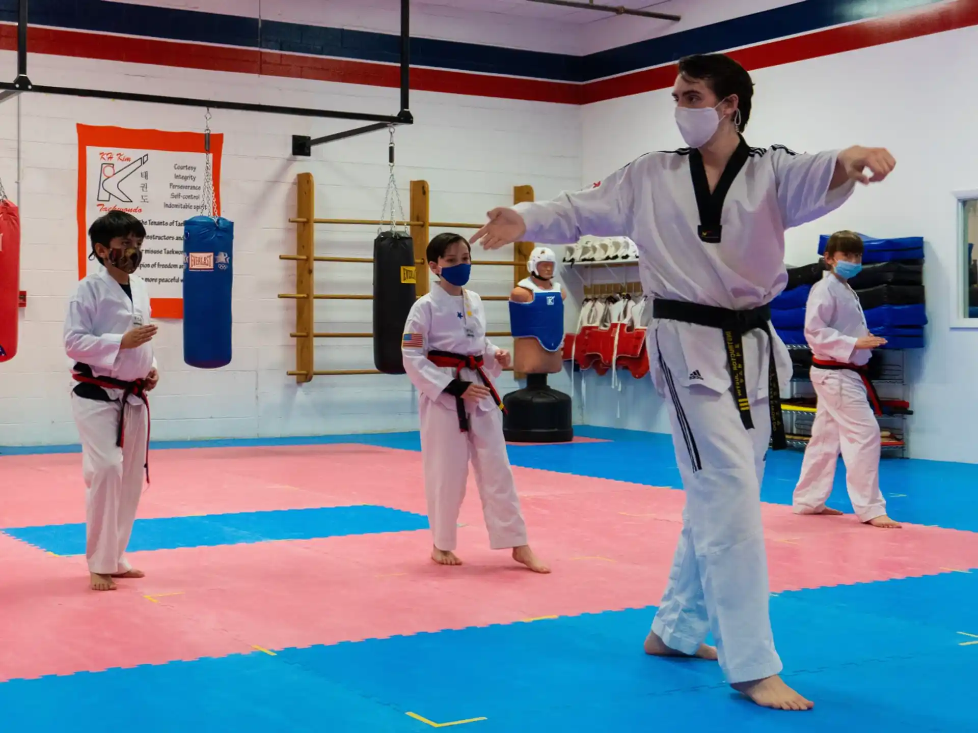 a group of people in karate uniforms