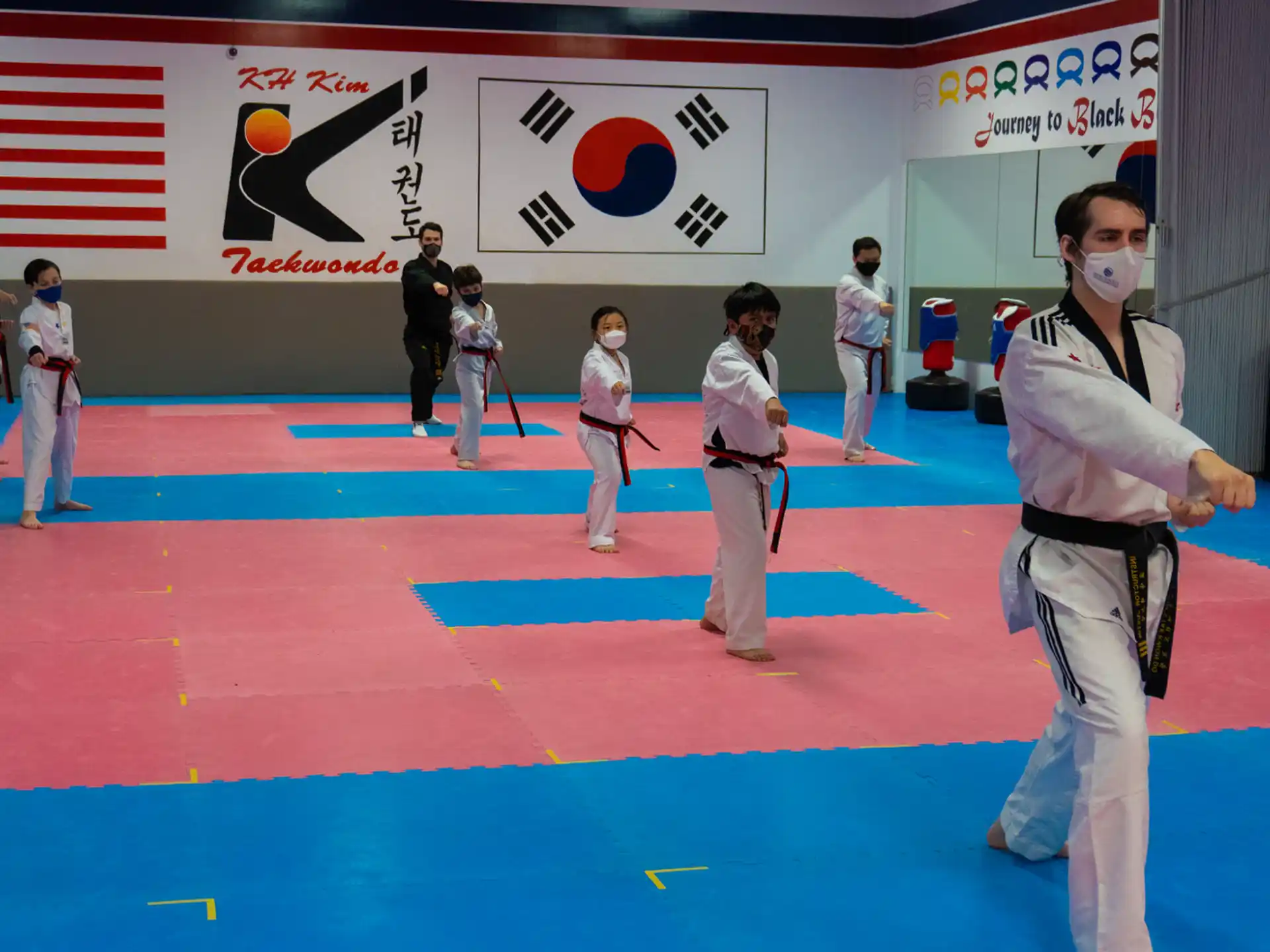 a group of people in karate uniforms