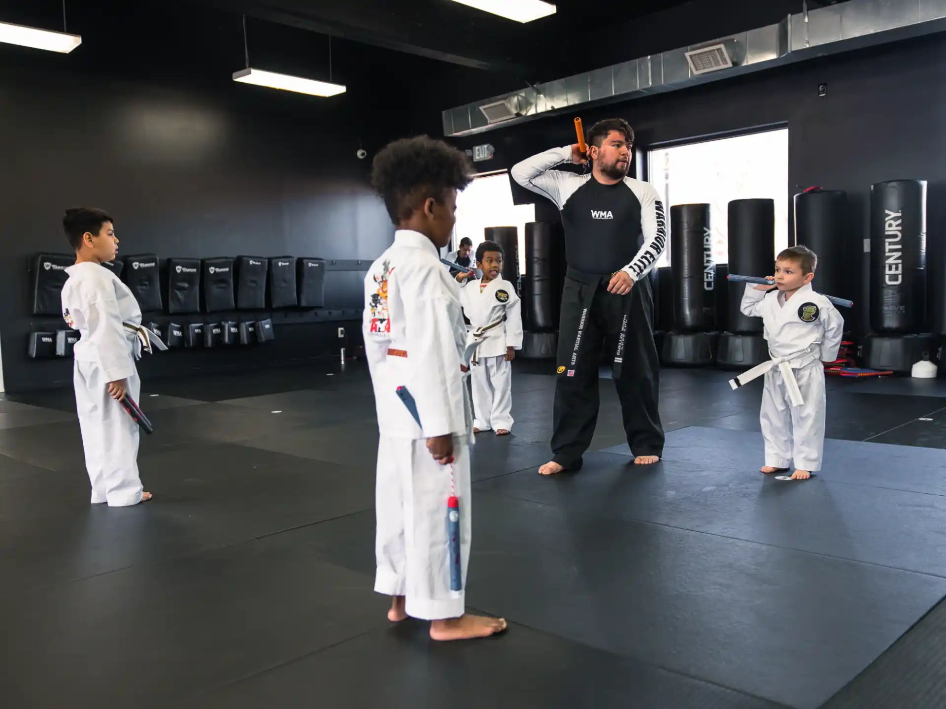 a group of people in white karate uniforms