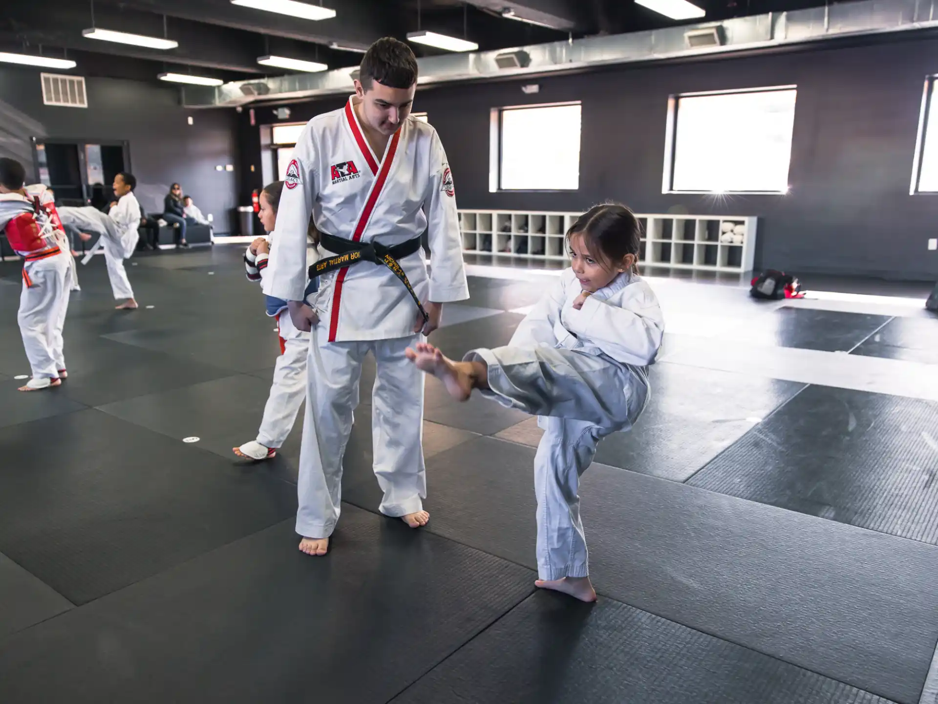 a man and a woman in karate uniforms