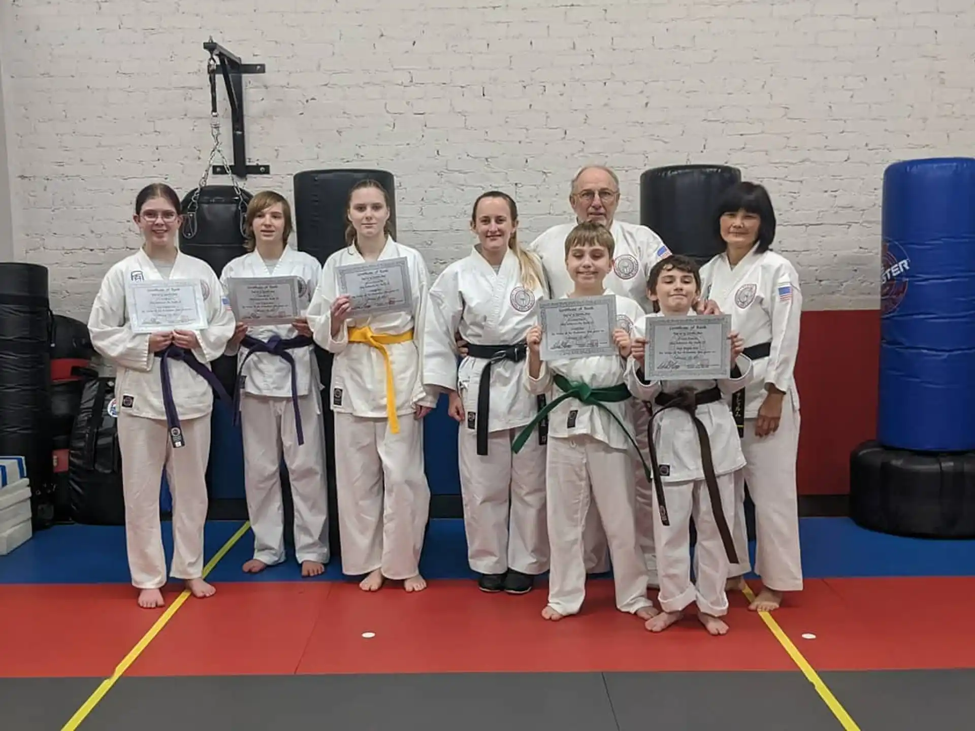 a group of people in karate uniforms