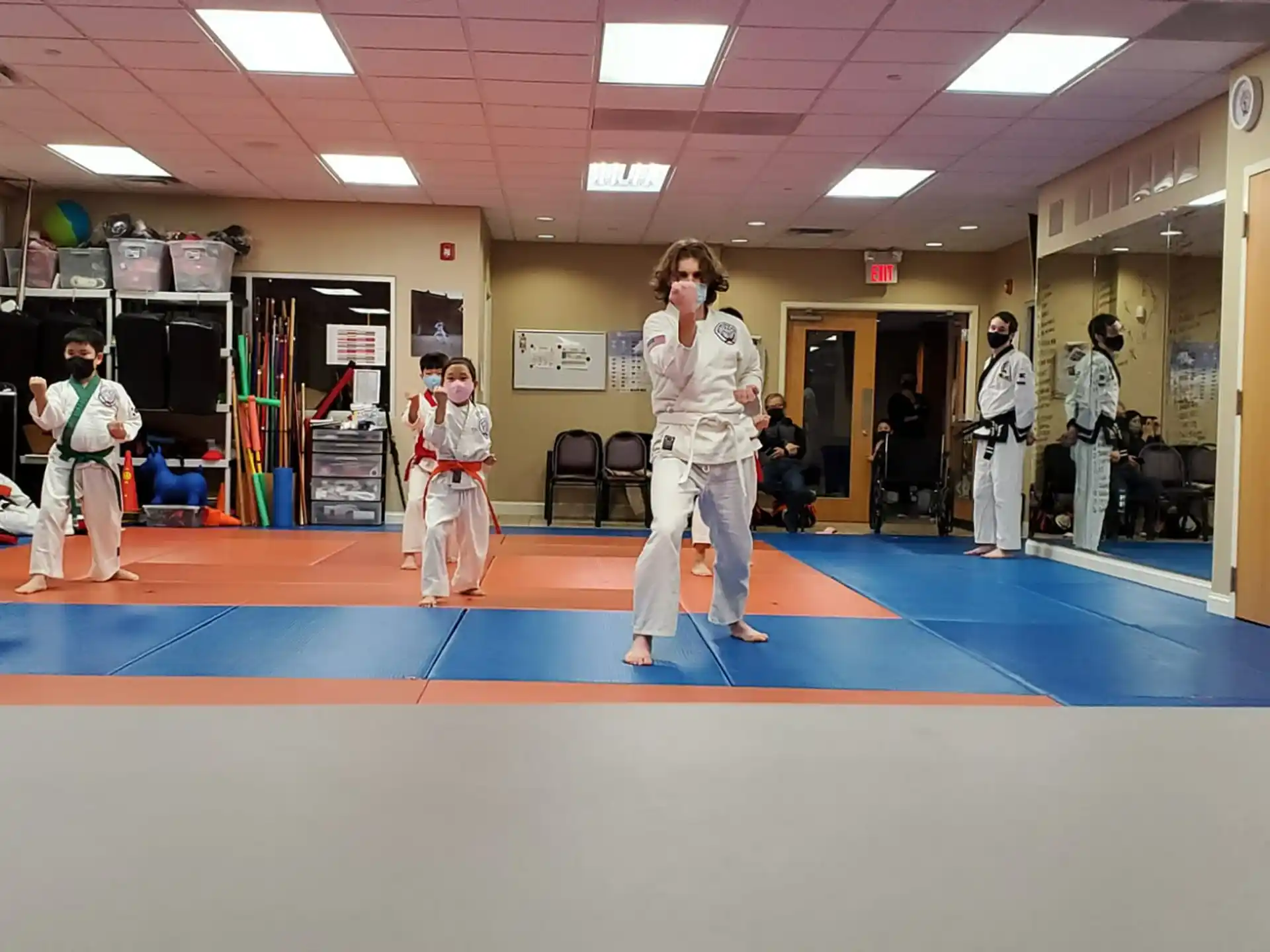 a group of people in karate uniforms