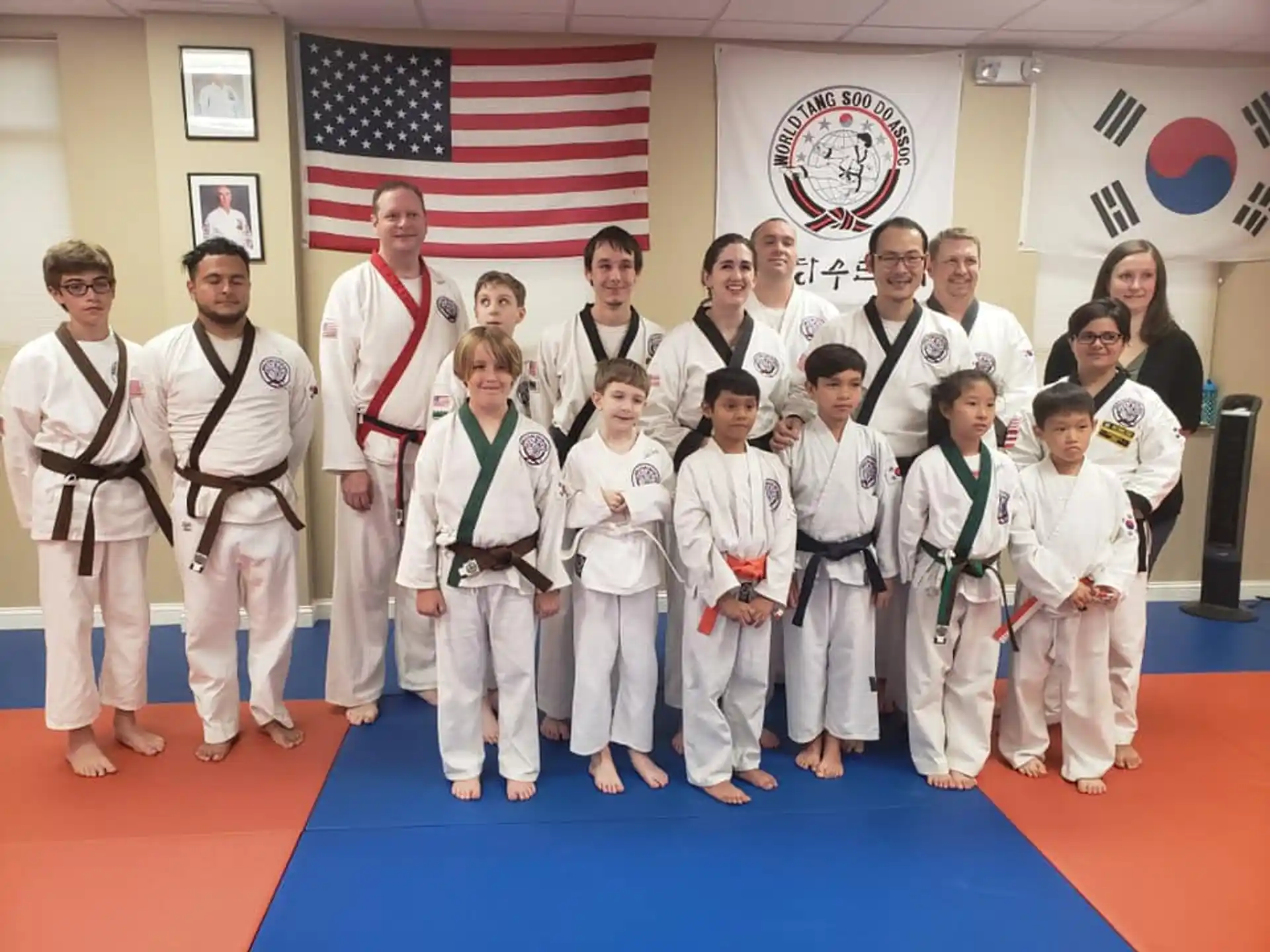 a group of people in karate uniforms