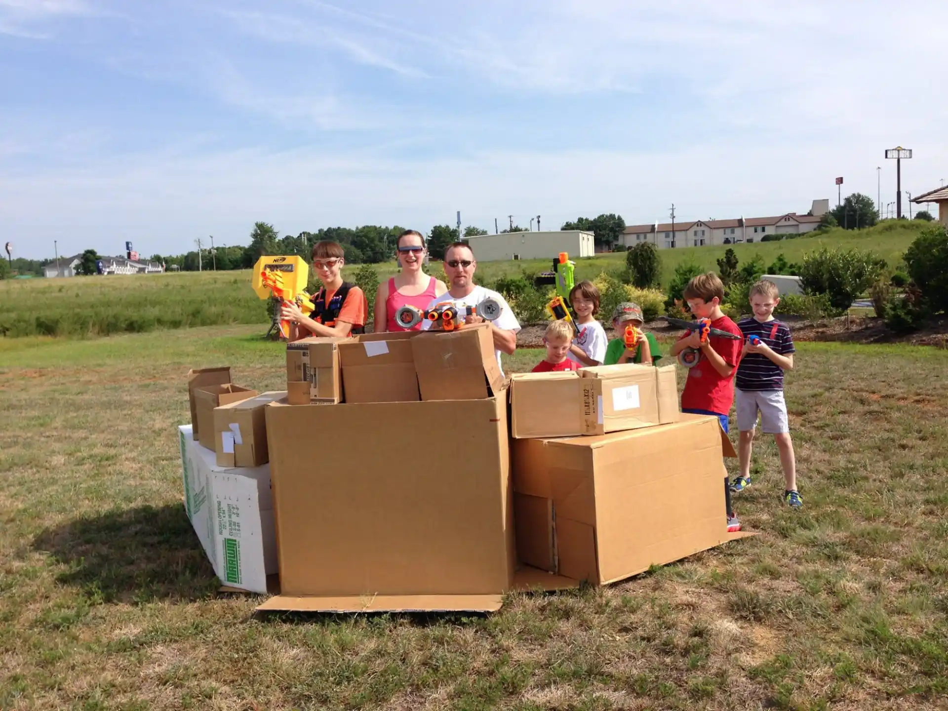 a group of people standing behind boxes