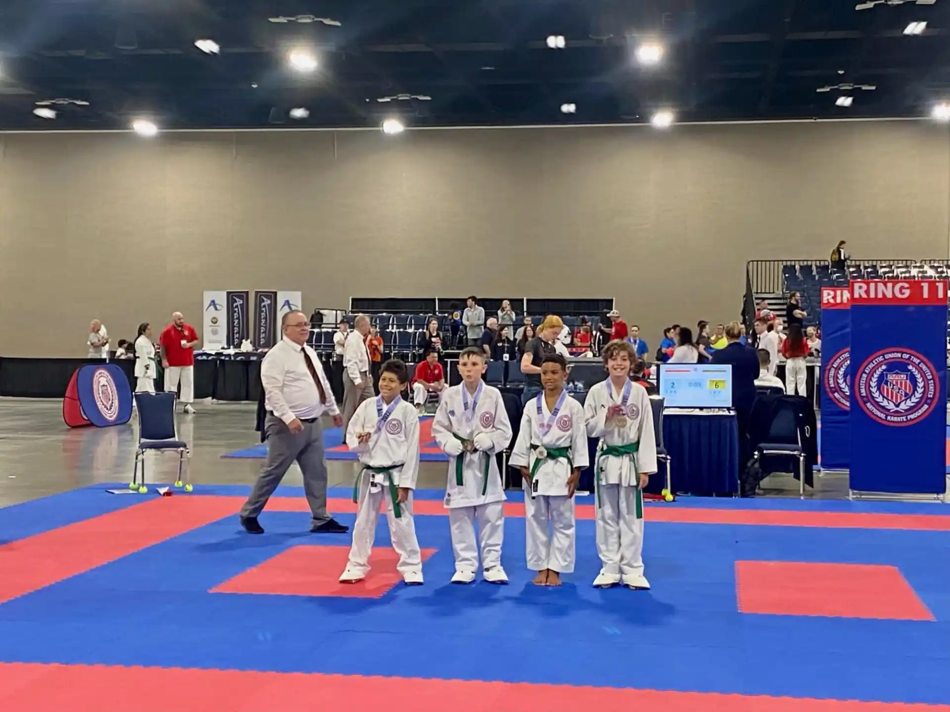 a group of people in karate uniforms