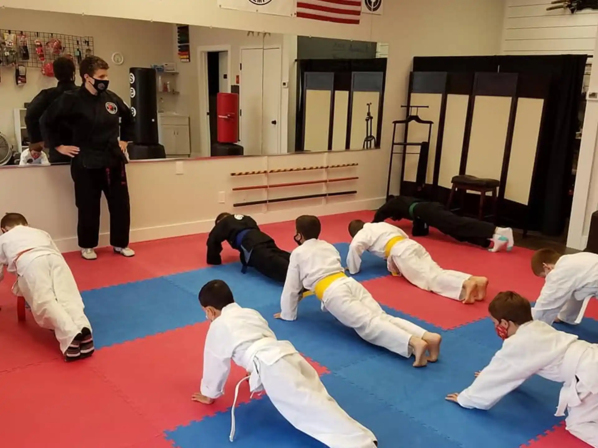 a group of people in karate uniforms