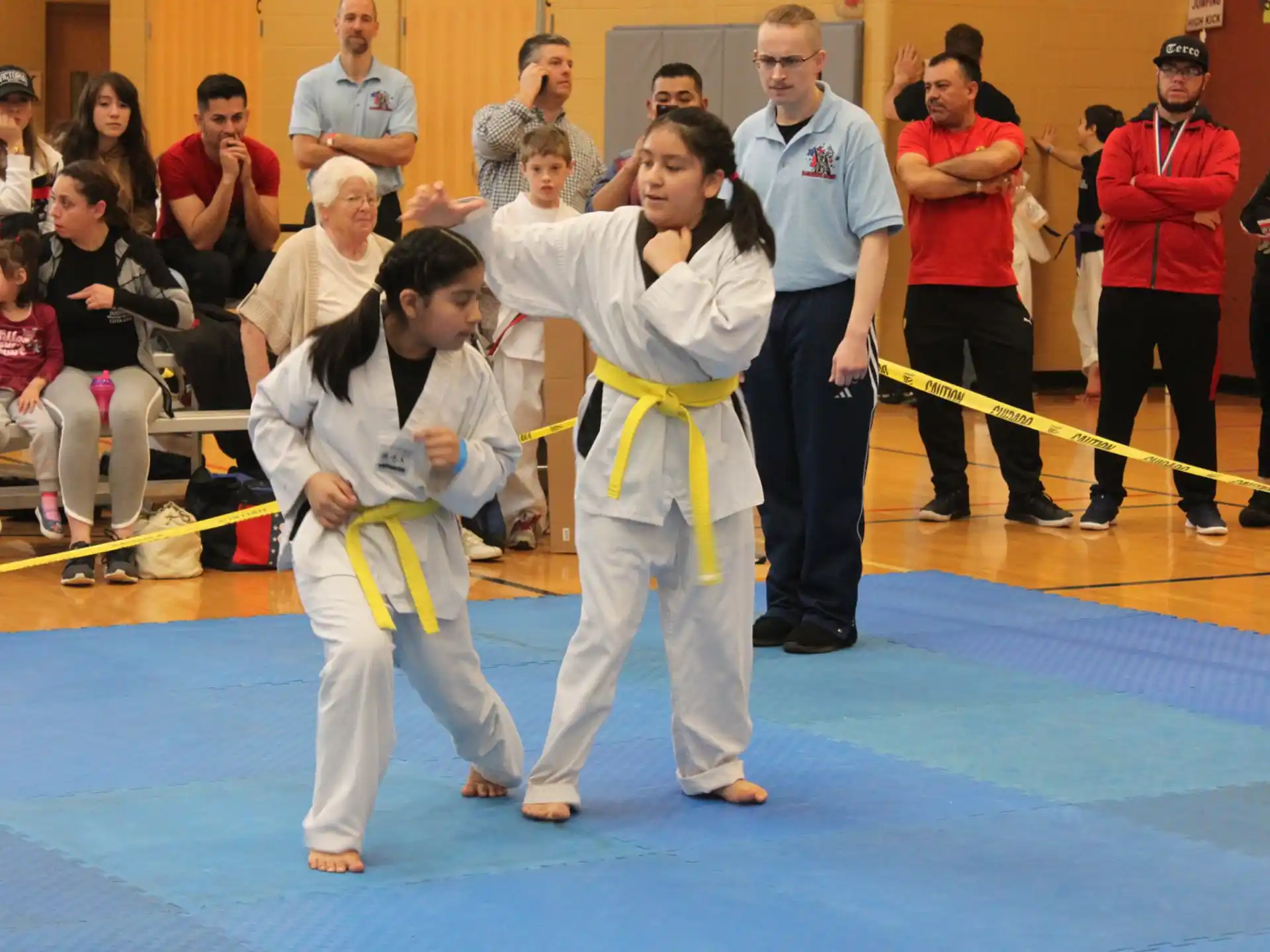 a couple of people in karate uniforms