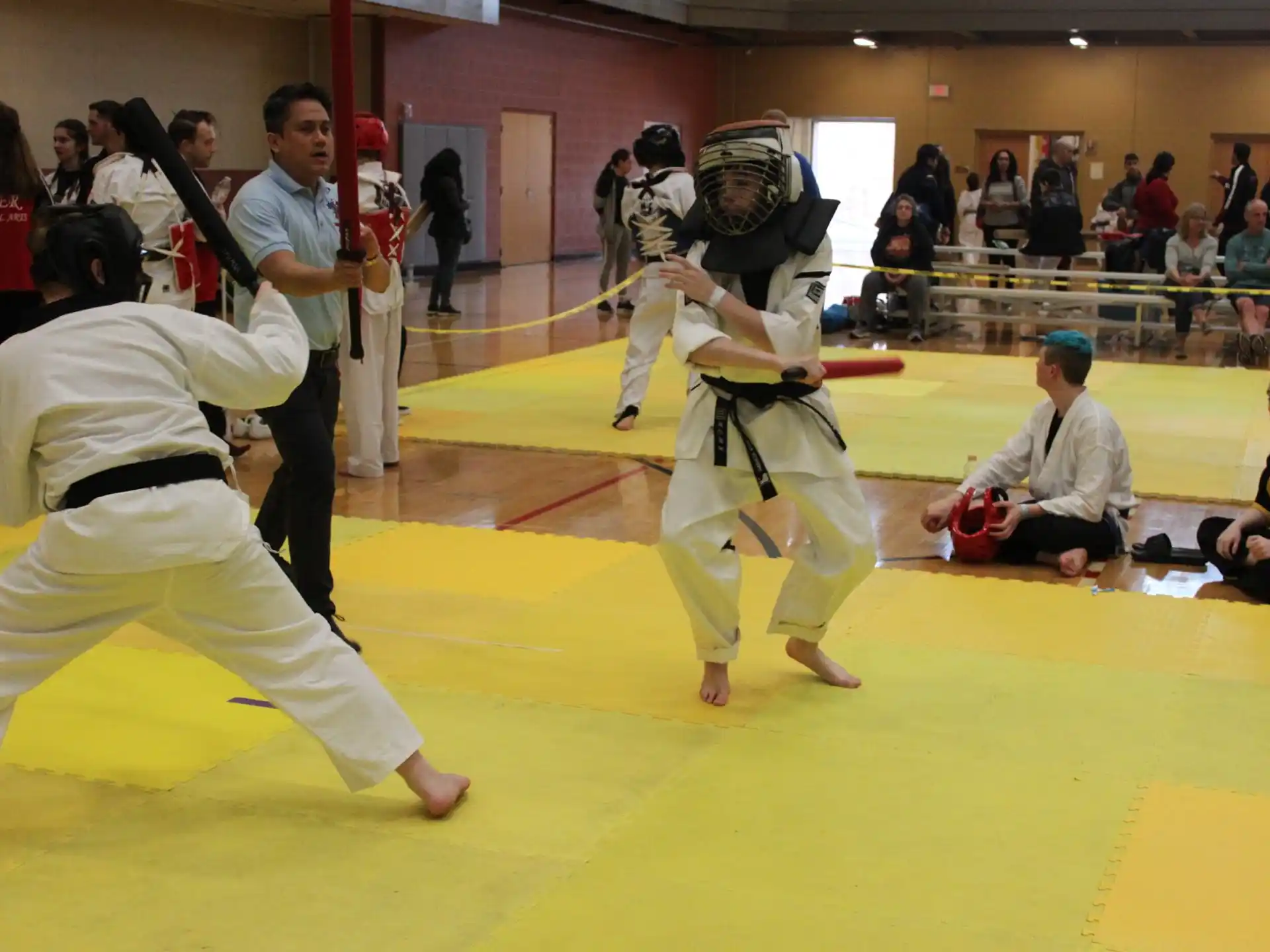 a group of people in a karate class