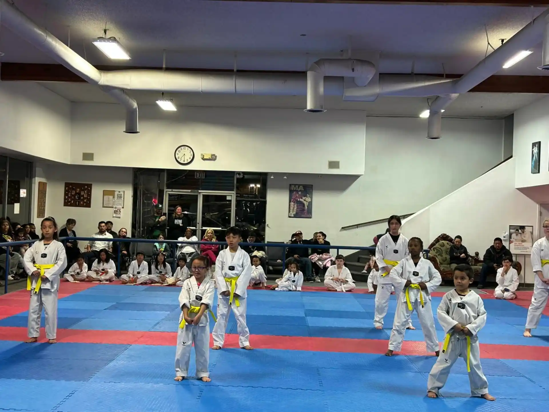a group of people in karate uniforms