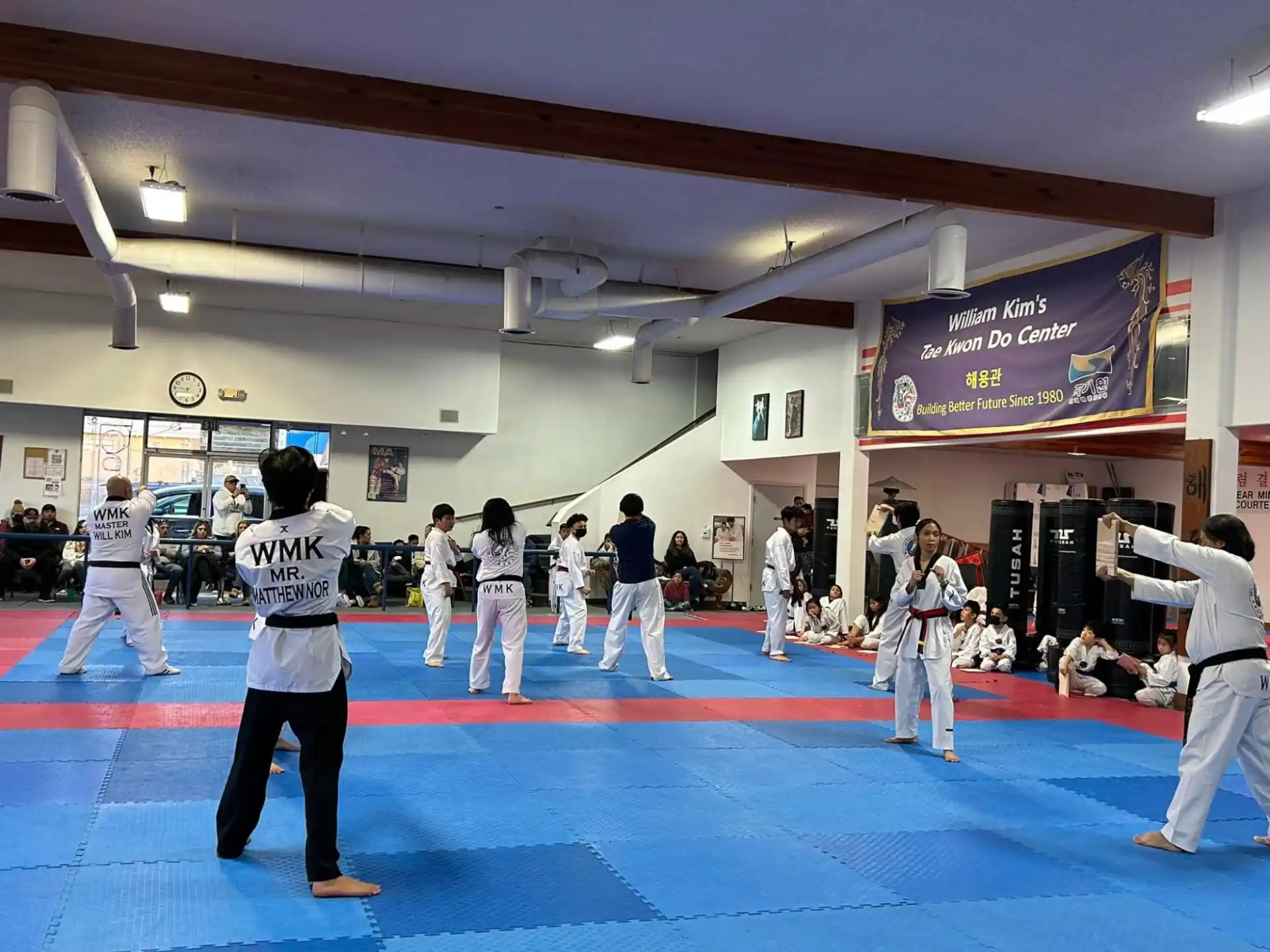 a group of people in karate uniforms