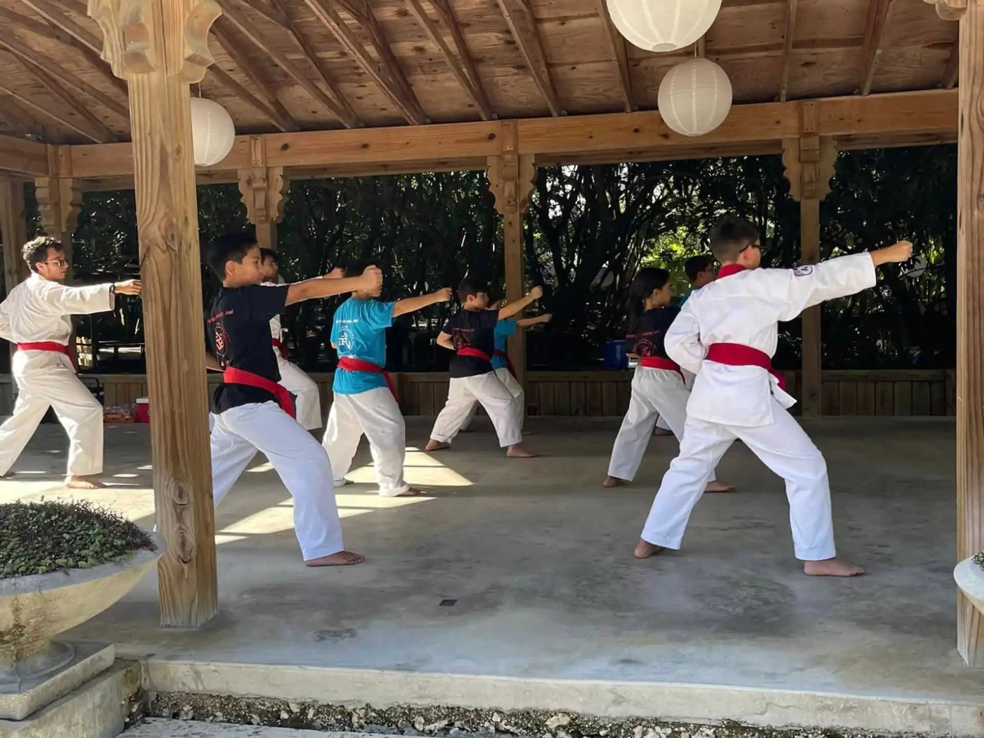 a group of people in a martial arts class