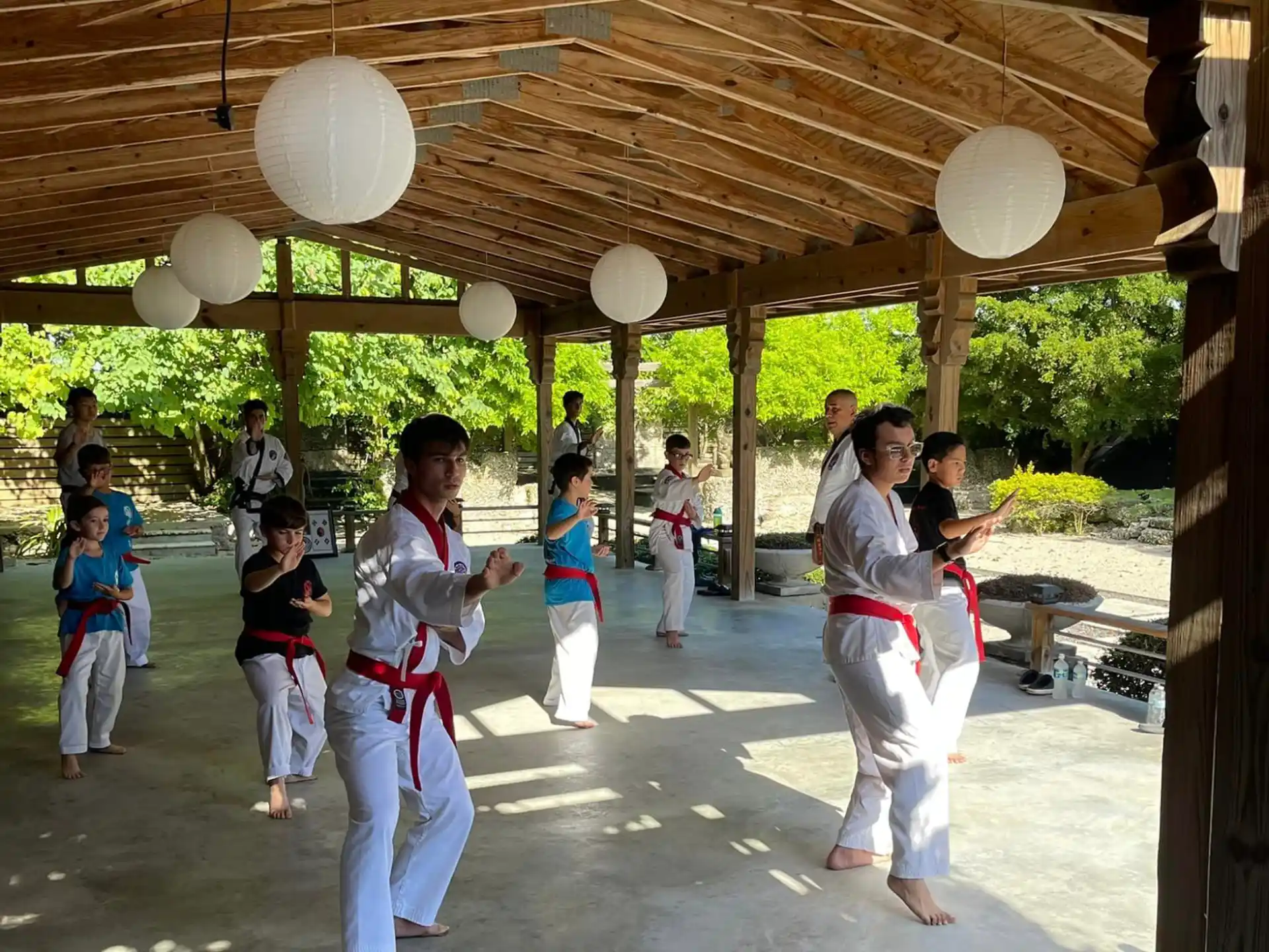 a group of people in karate uniforms
