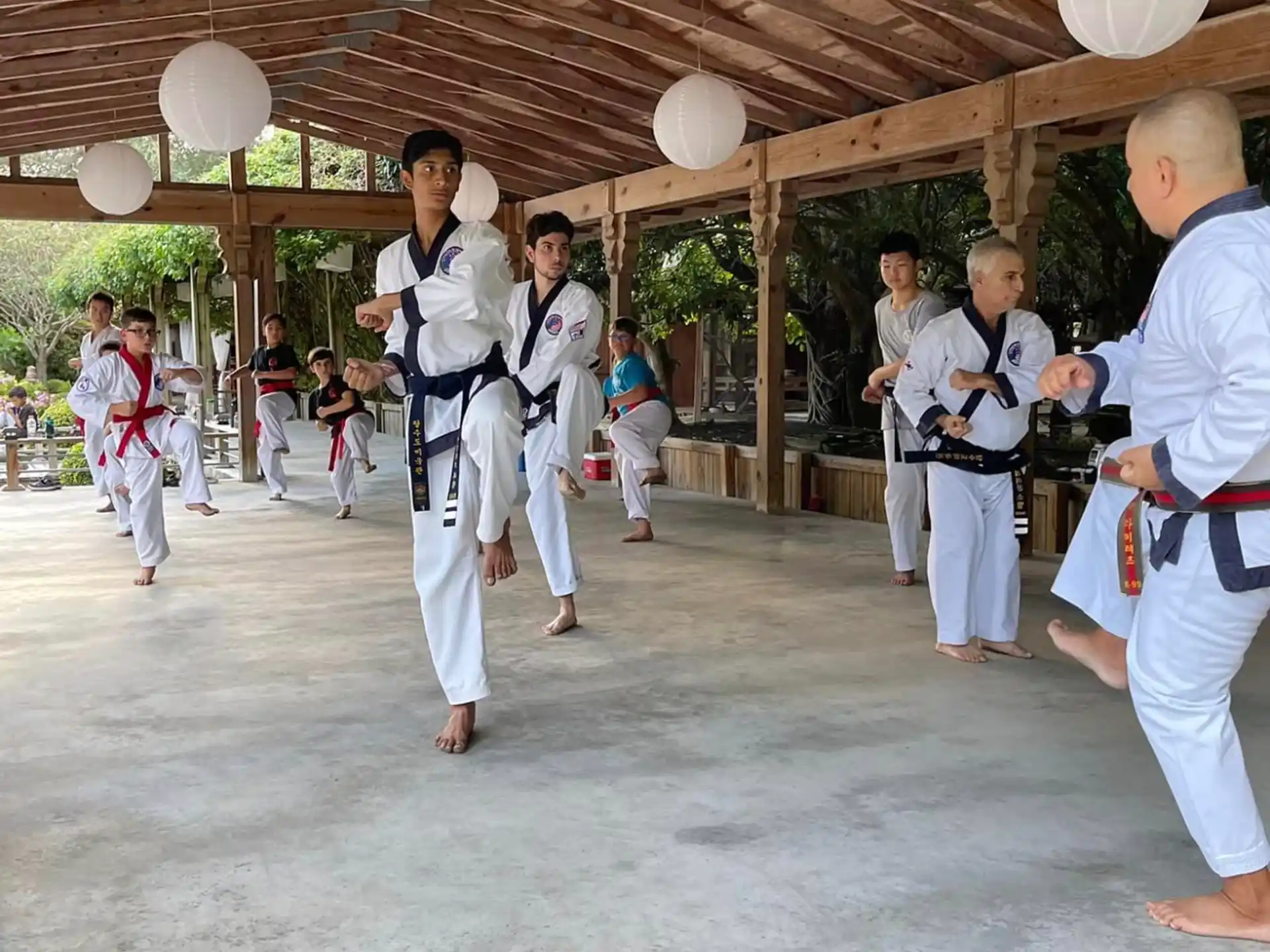 a group of people in karate uniforms