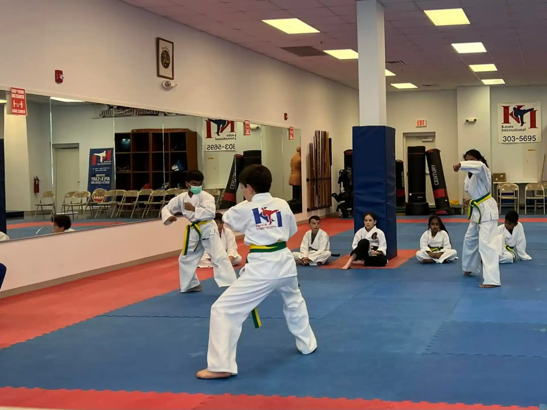 a group of people in a karate class