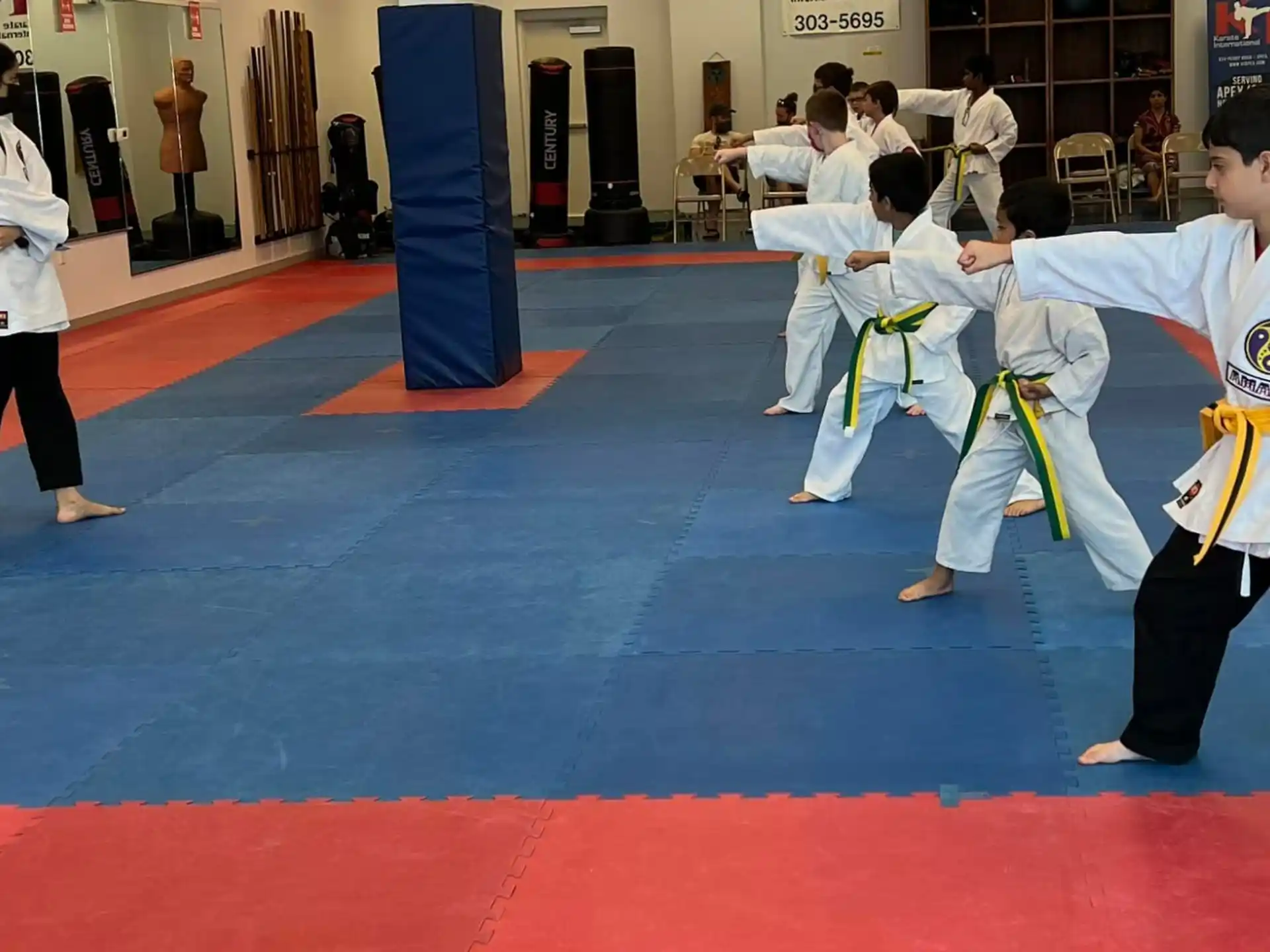 a group of people in karate uniforms