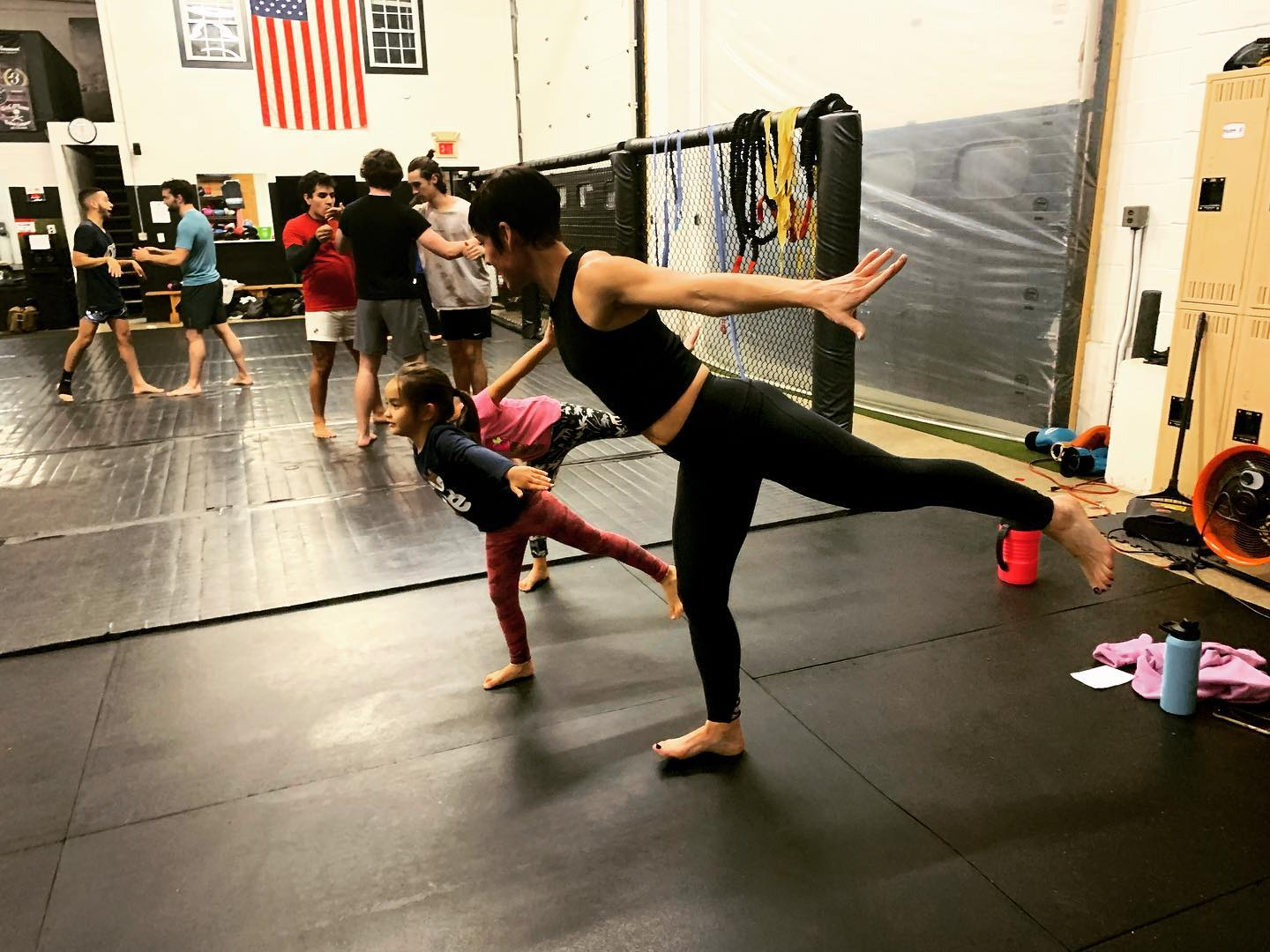 a man and a woman doing yoga