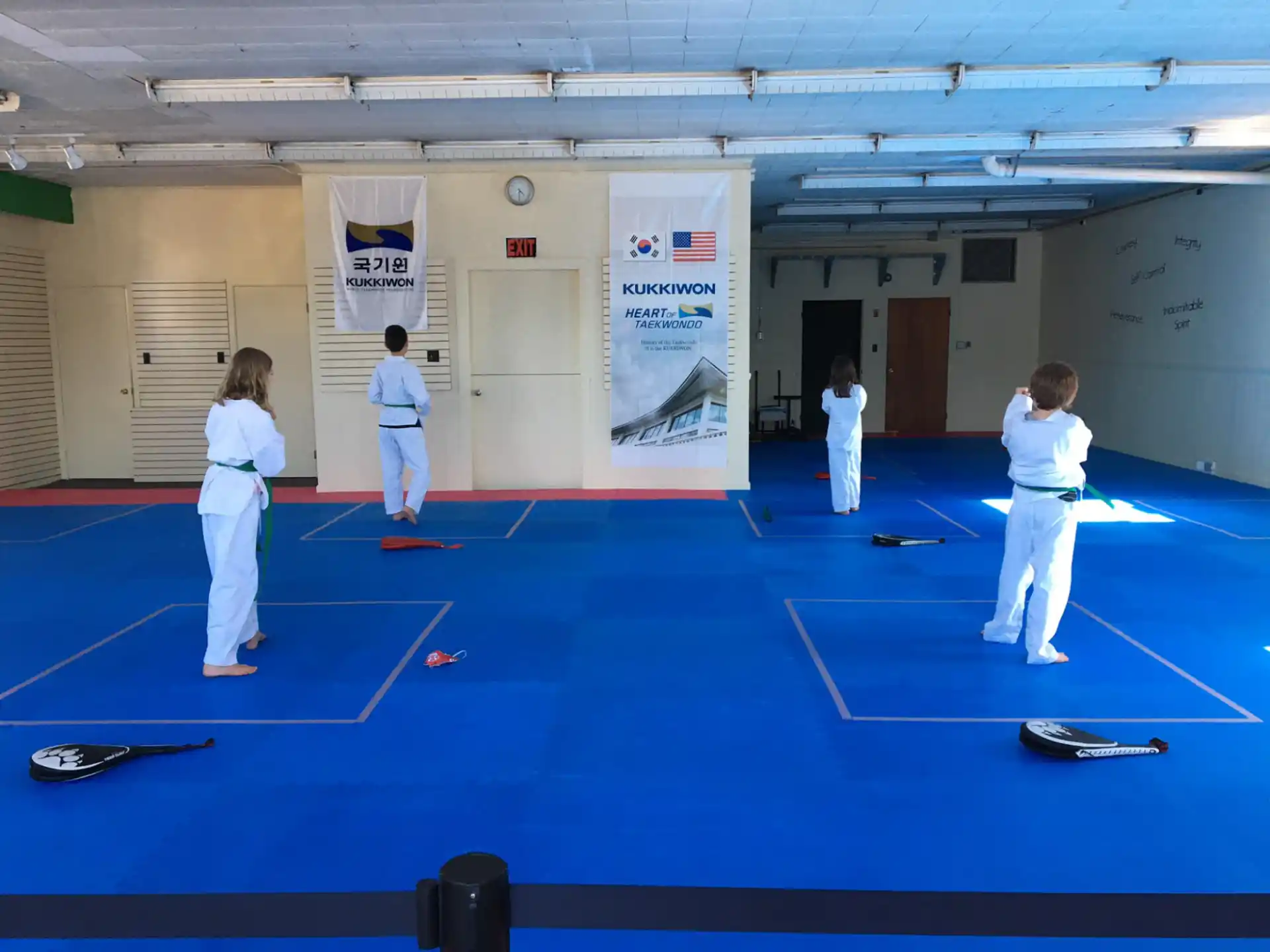 a group of people in karate uniforms