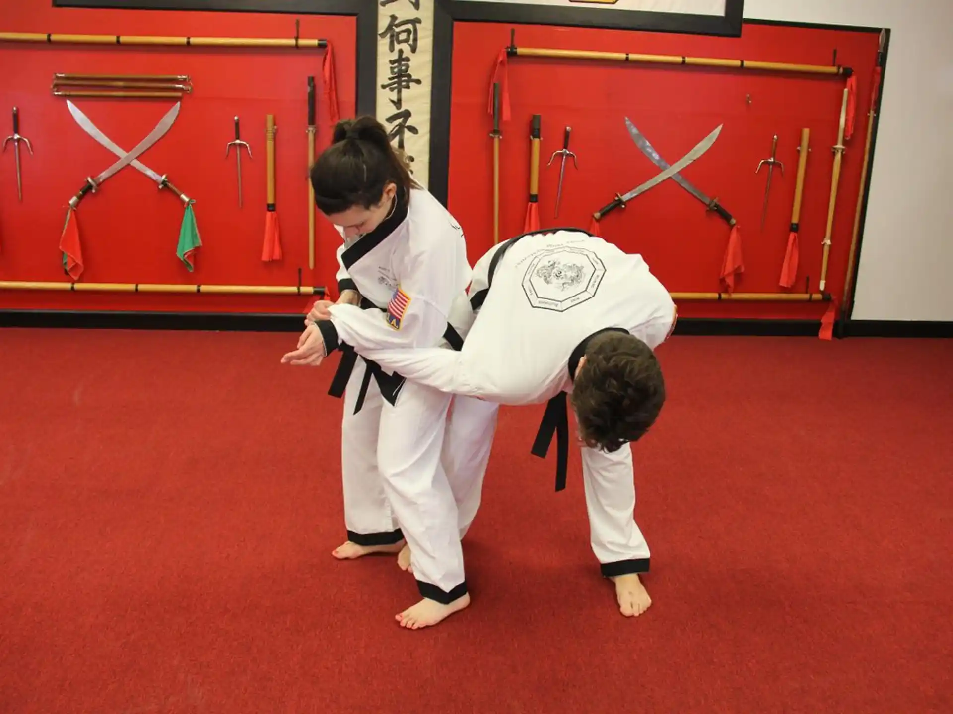 a couple of people in karate uniforms