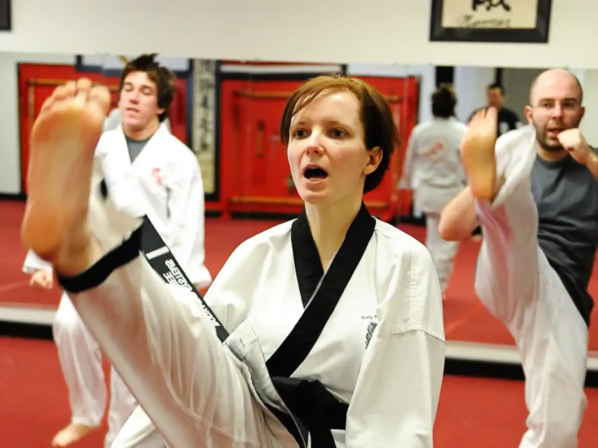 a group of people in karate uniforms