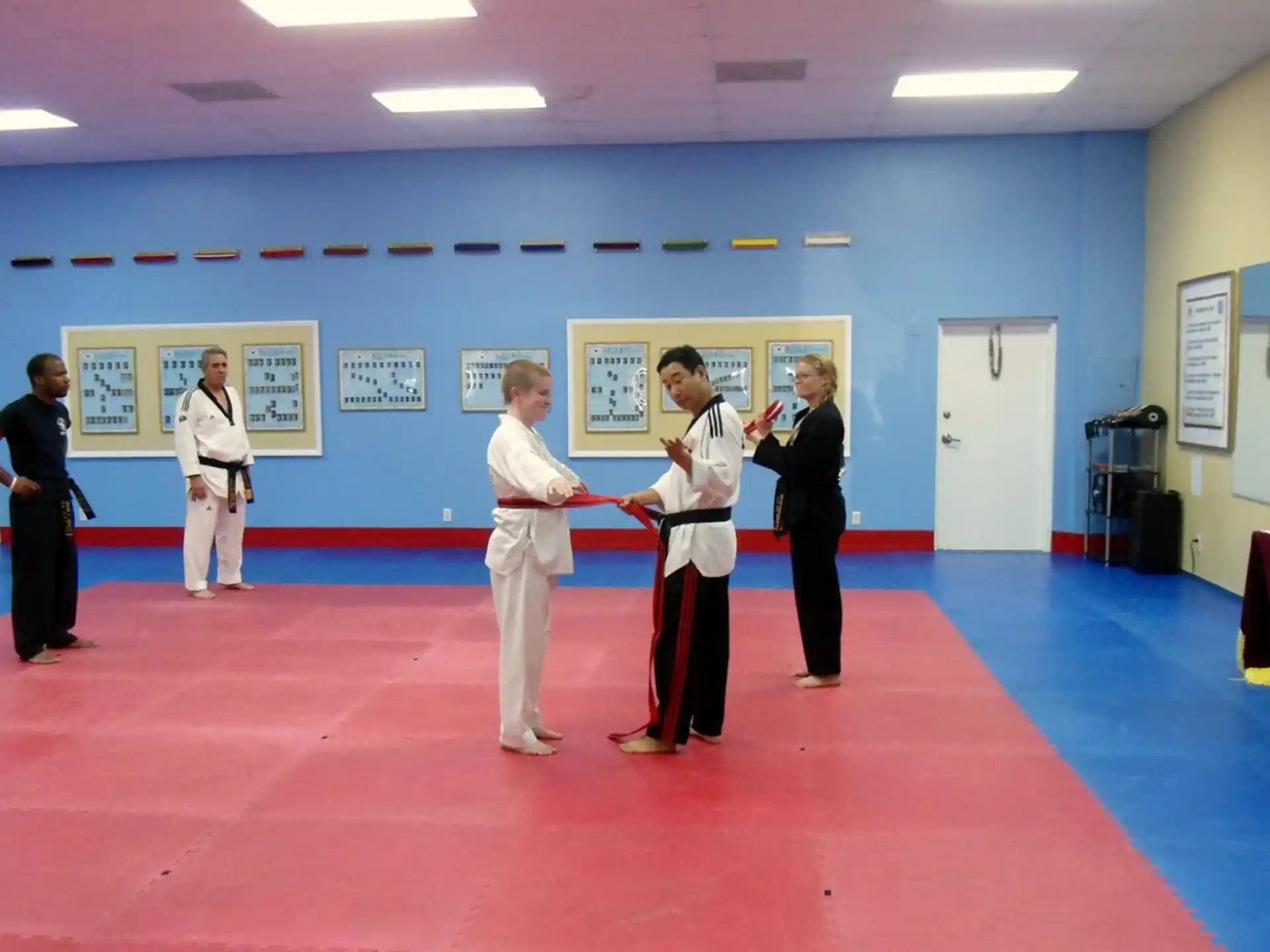a group of people in karate uniforms