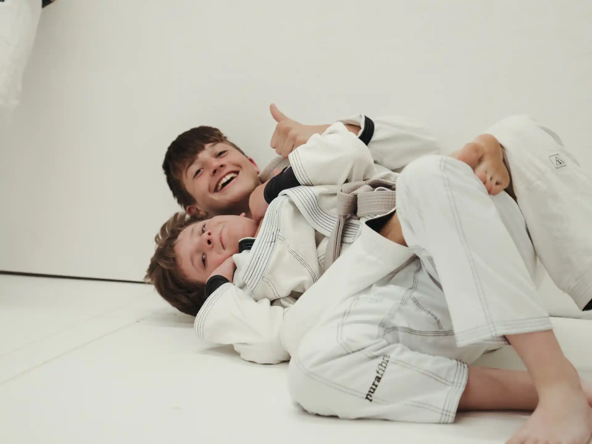 a man and a woman in karate uniforms
