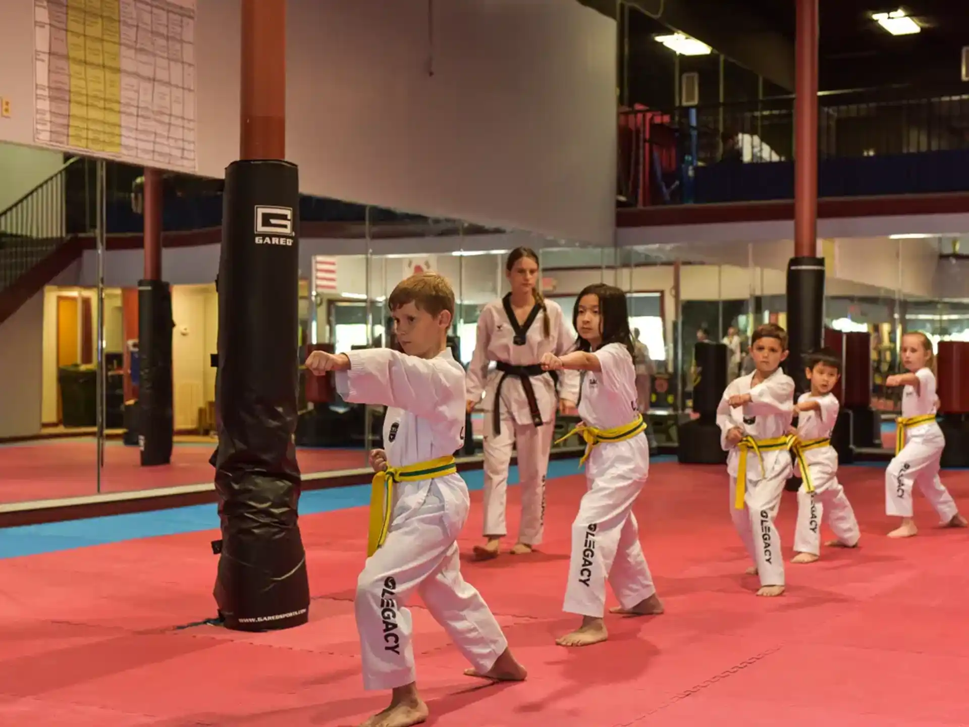 a group of people in karate uniforms