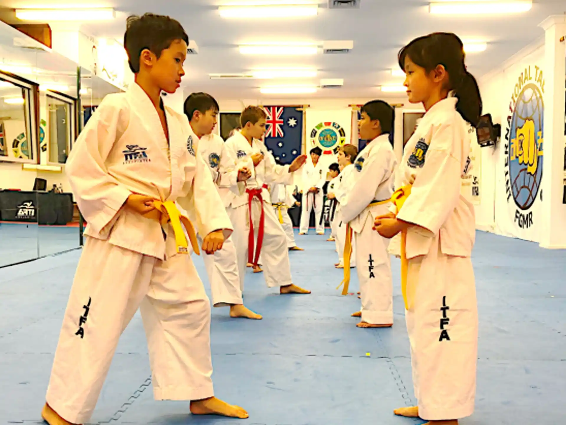 a group of people in karate uniforms