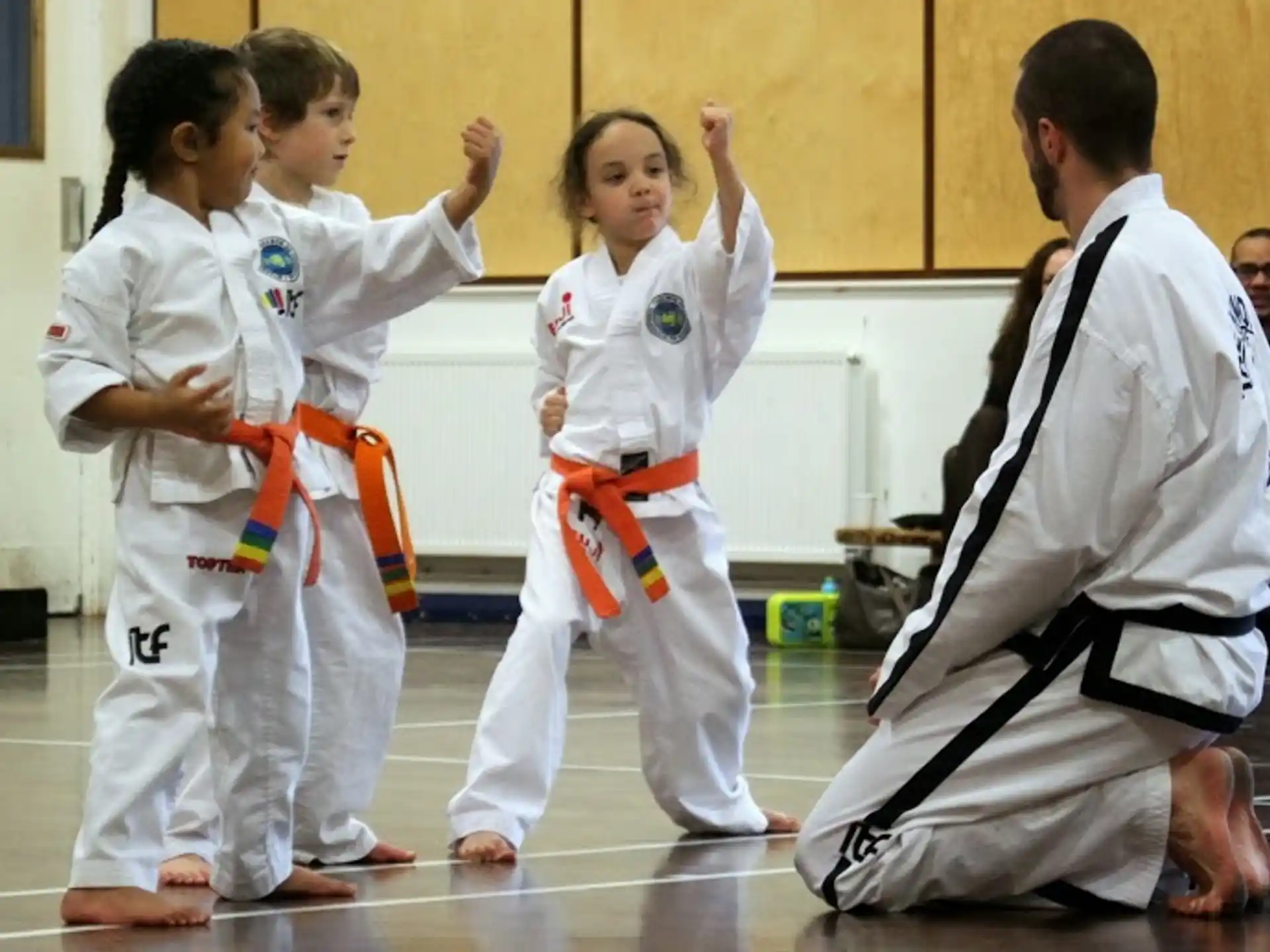 a group of people in karate uniforms