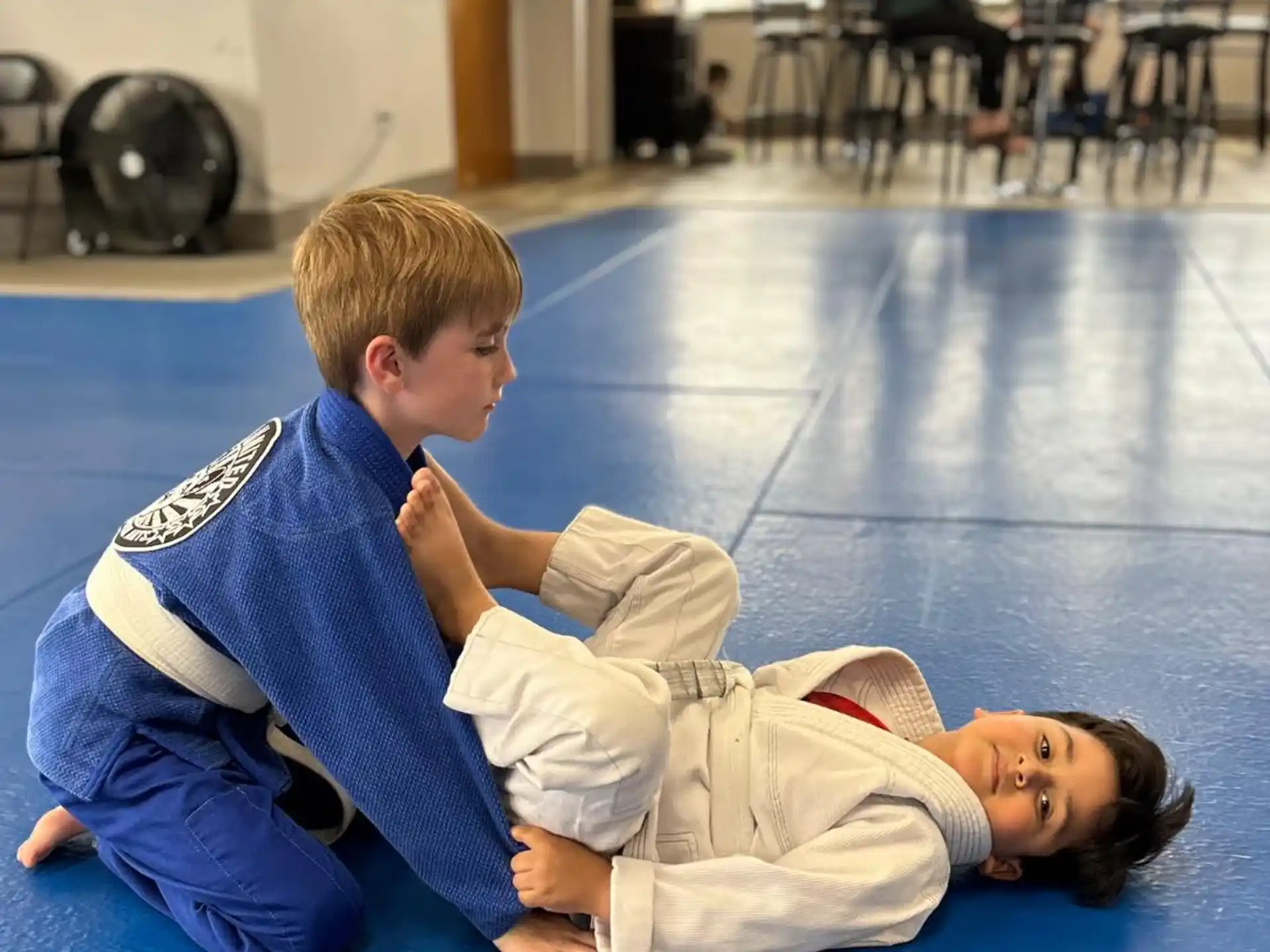 a couple of boys lying on the floor