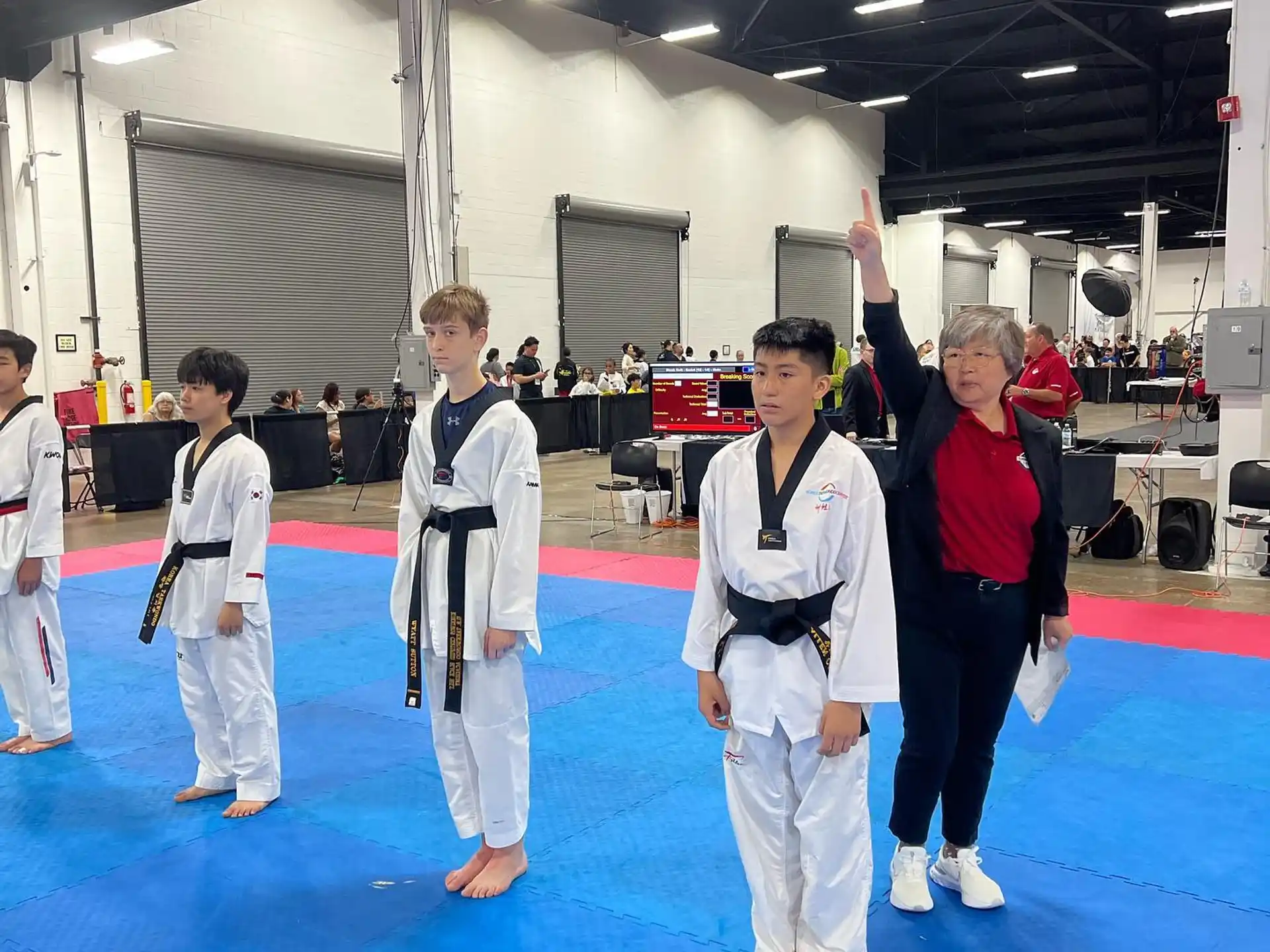 a group of people in karate uniforms