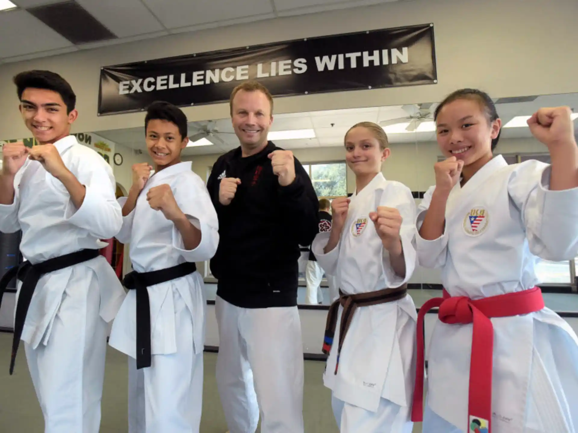 a group of people in karate uniforms