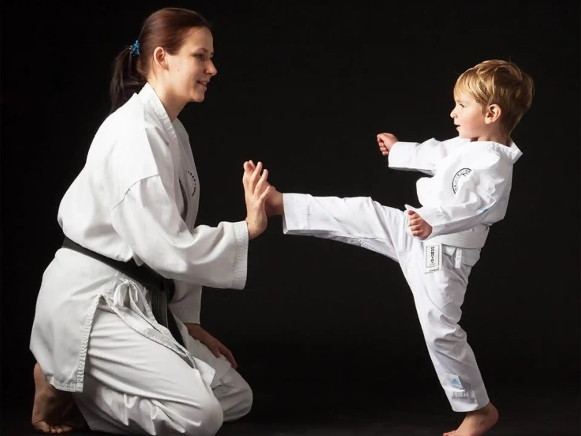 a man and a child in karate uniforms