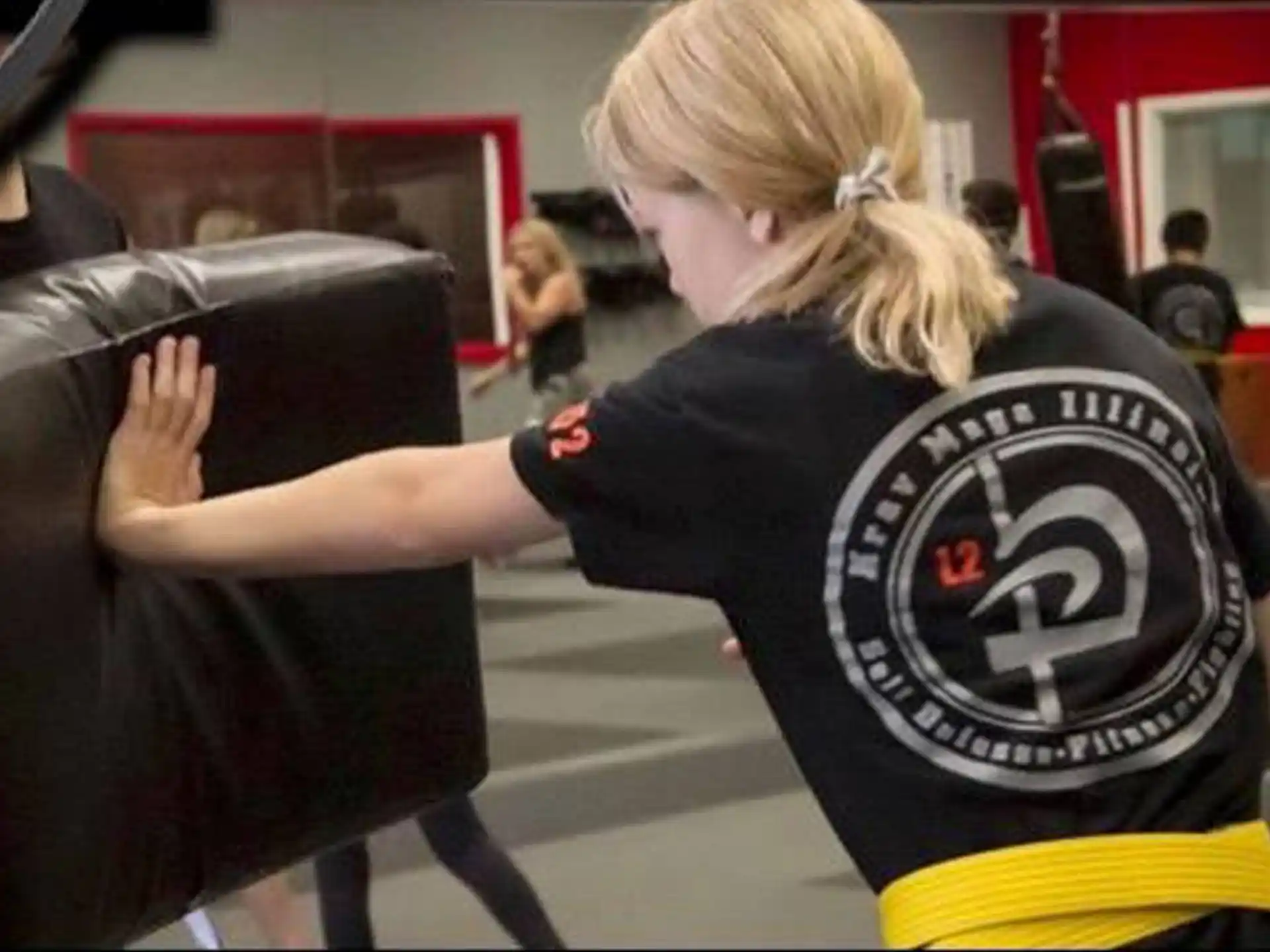 a woman holding a man's back