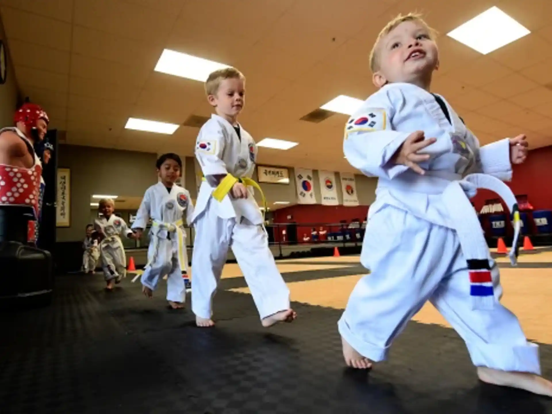 a group of kids in karate uniforms