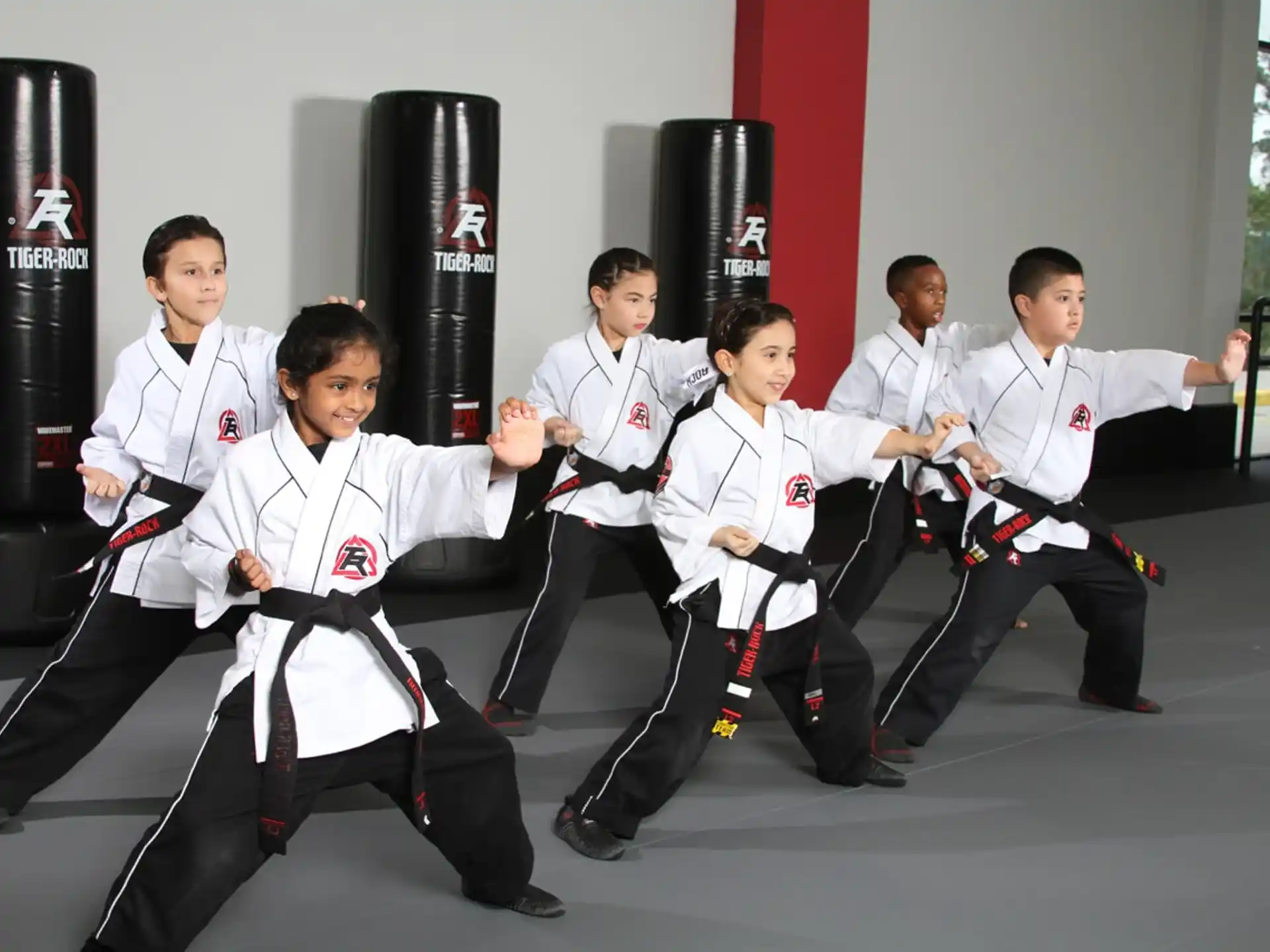 a group of people in karate uniforms