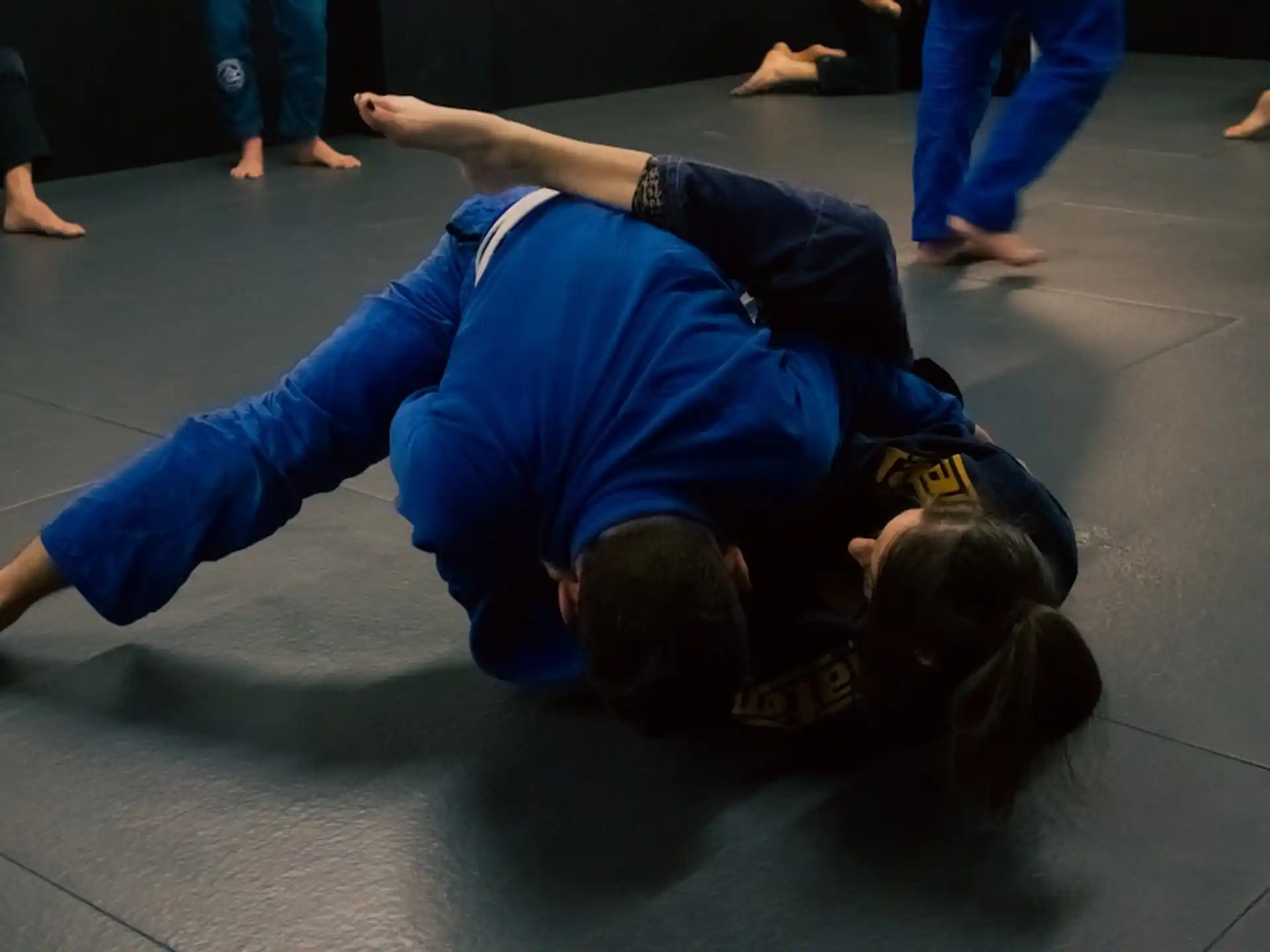 a man and woman doing push ups