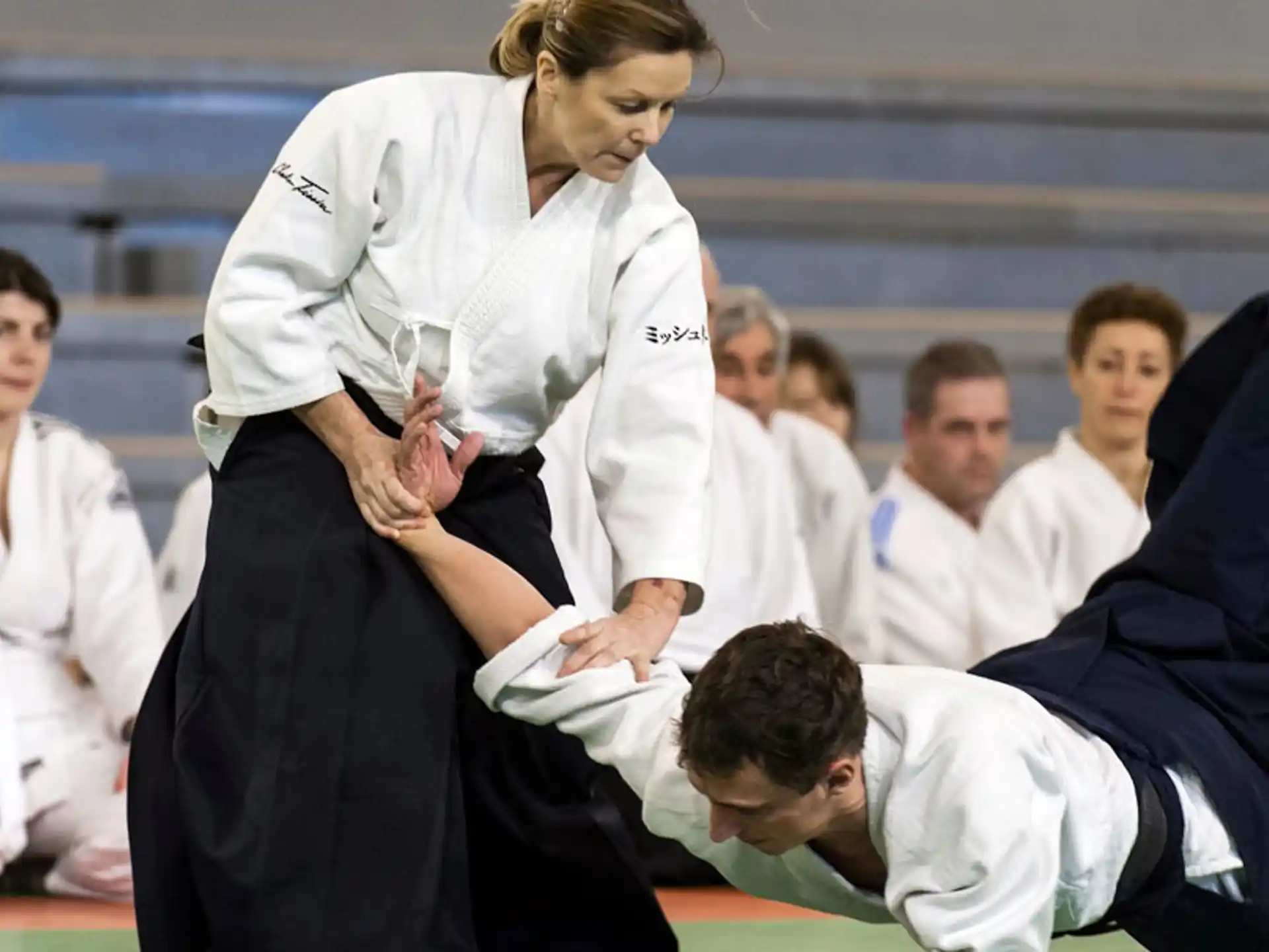 a group of people in karate uniforms