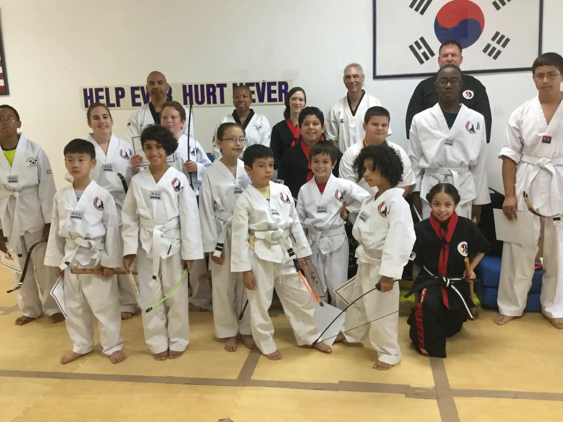a group of people in karate uniforms