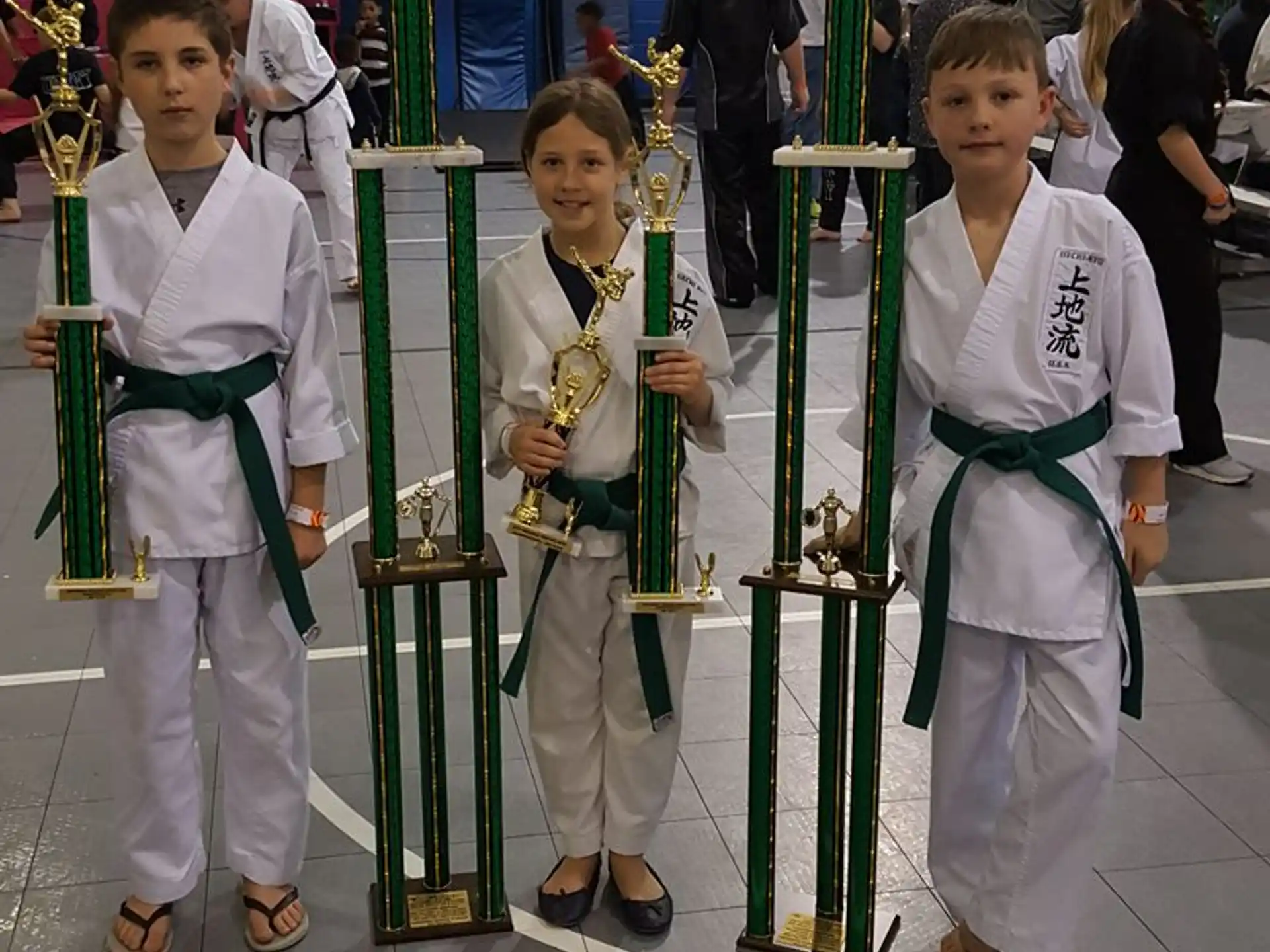 a group of kids in karate uniforms