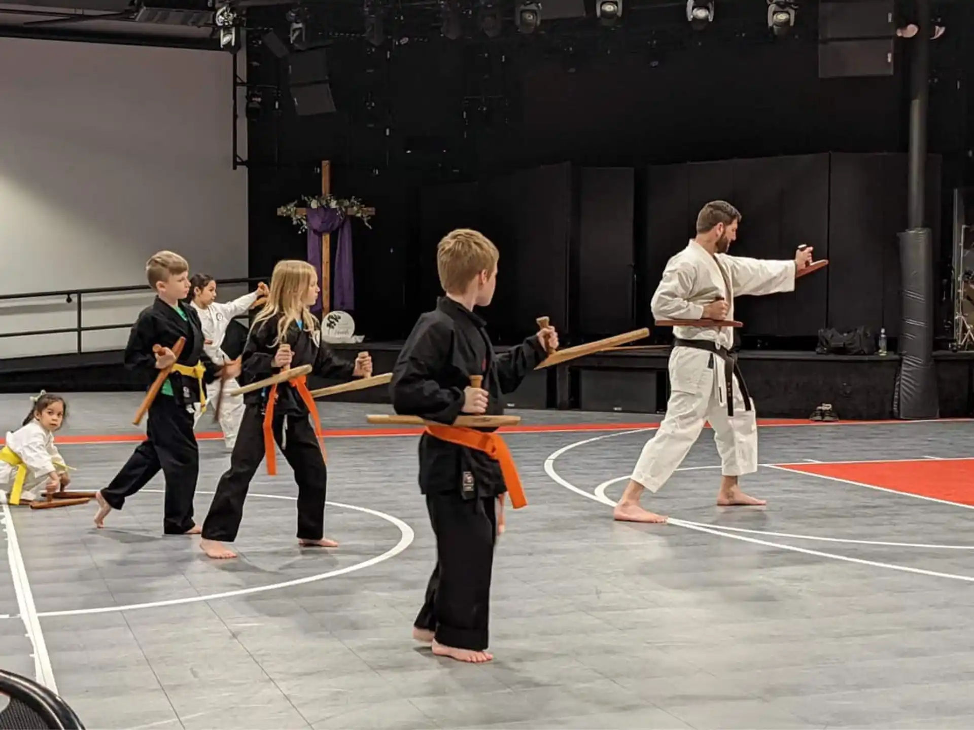 a group of people in karate uniforms