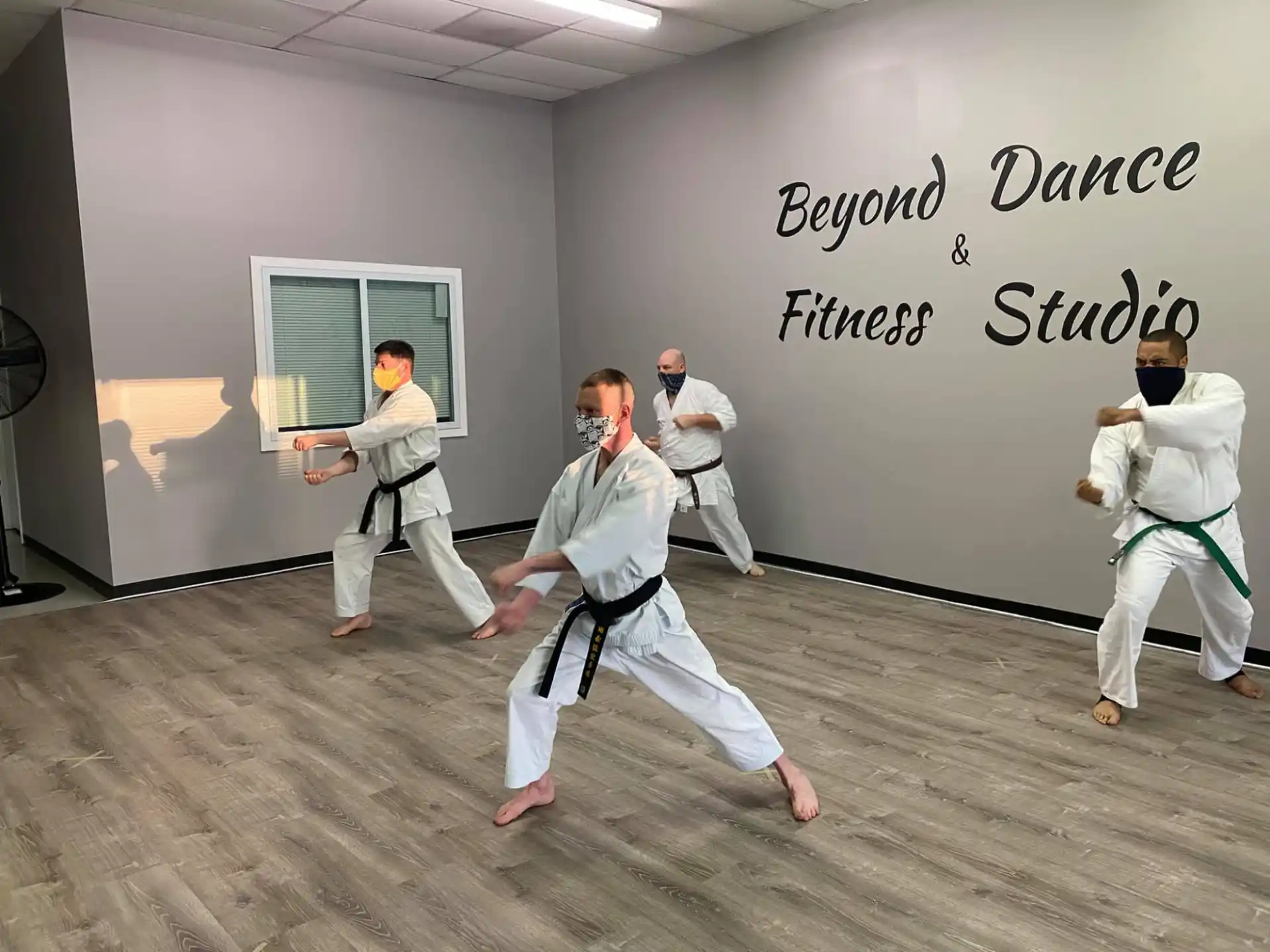 a group of people in karate uniforms