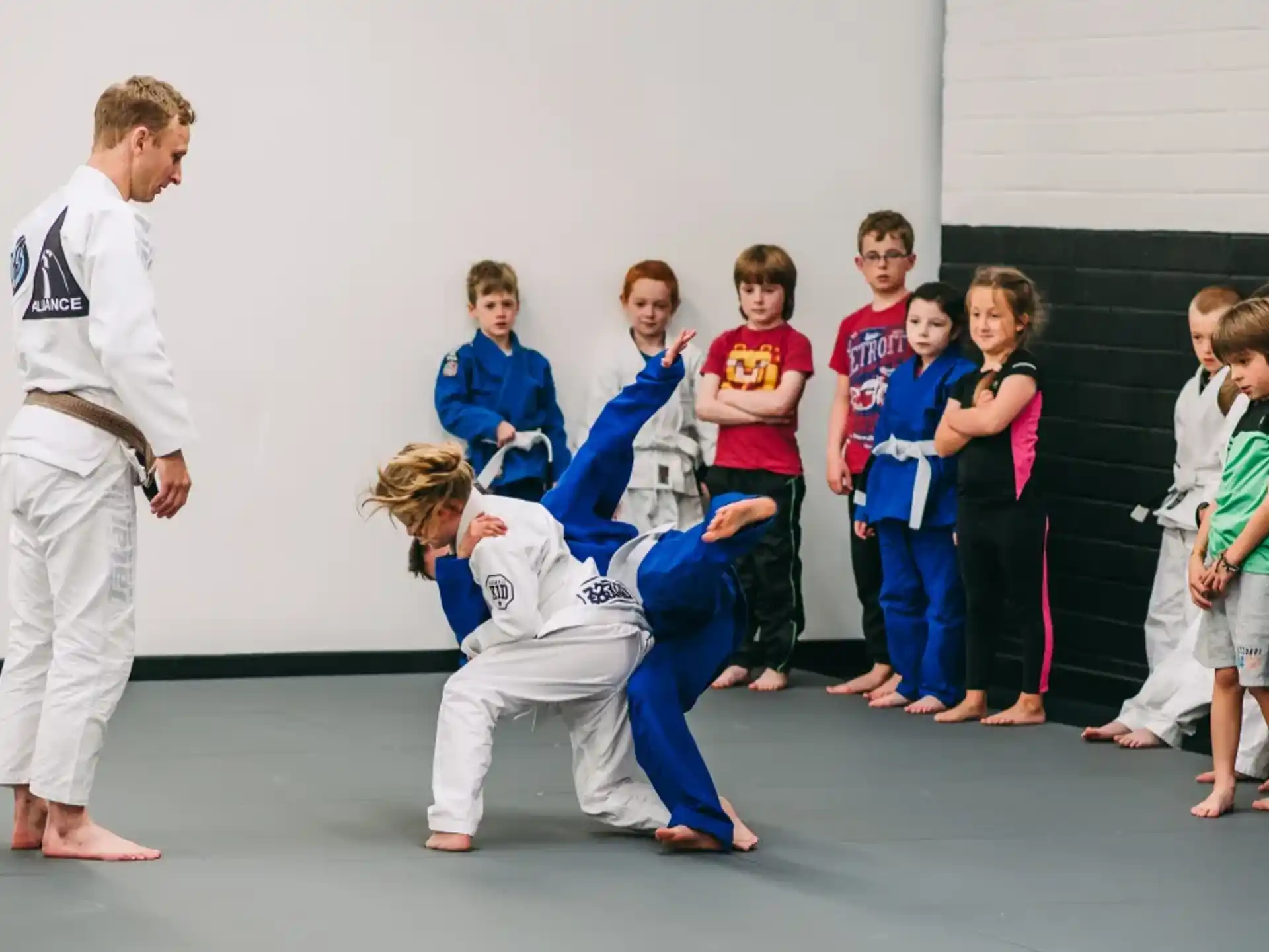 a group of people in karate uniforms