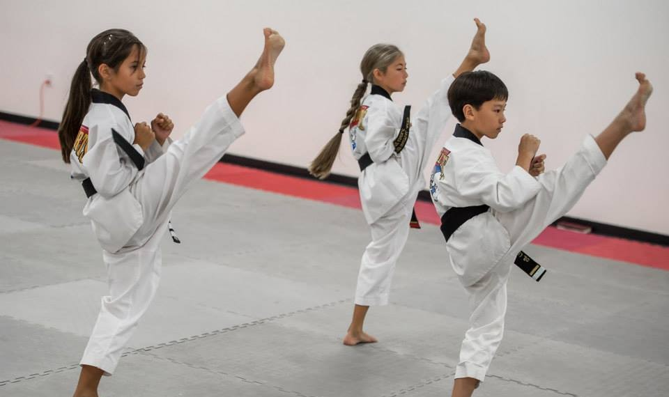a group of people in karate uniforms