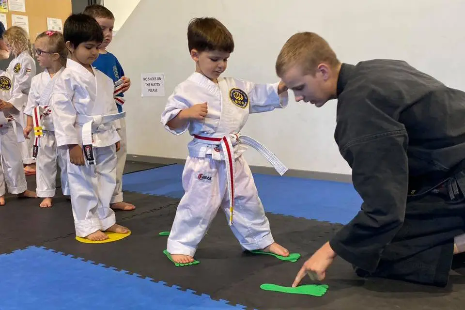 a man and a boy in karate uniforms